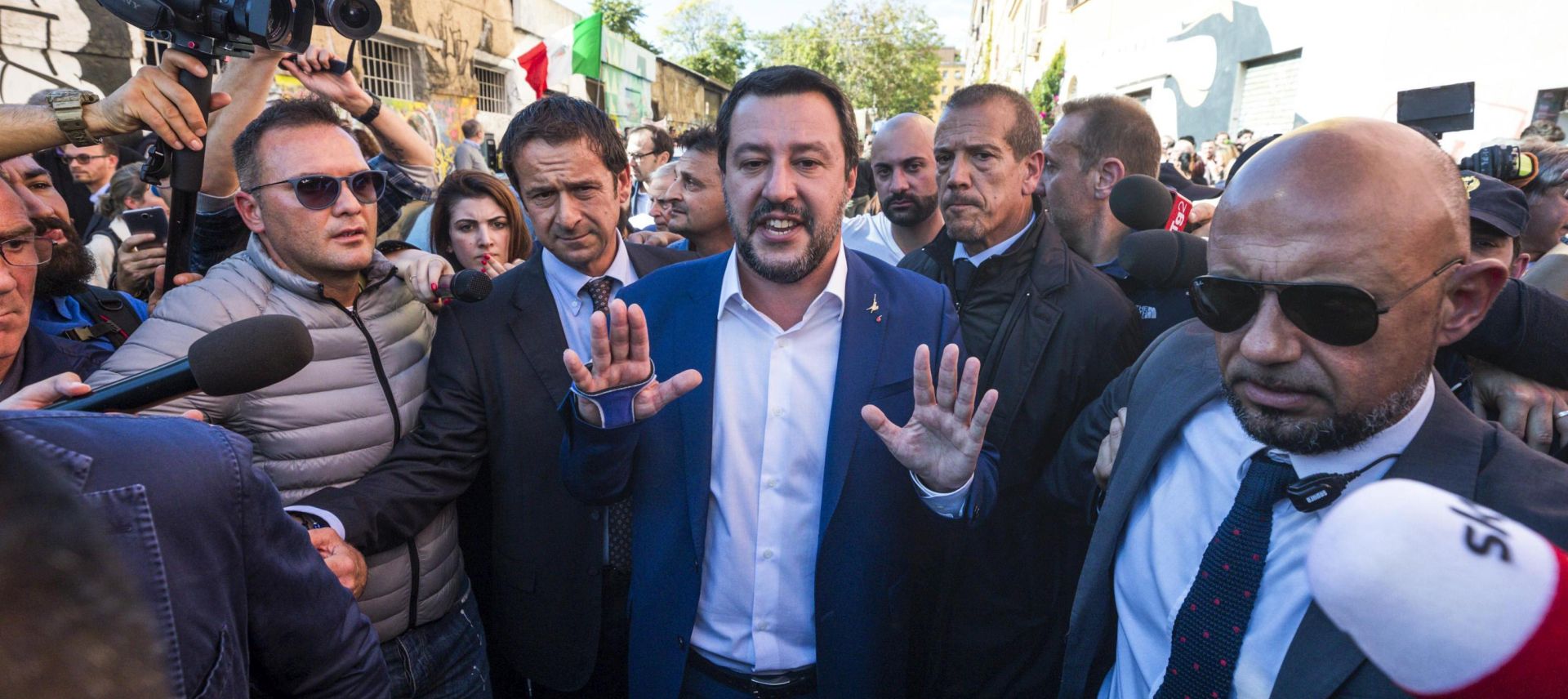 epa07116131 Interior Minister and Deputy Premier Matteo Salvini (C) reacts as he visited the abandoned building in the San Lorenzo district of Rome where 16-year-old girl Desiree Mariottini's body was found recently, in Rome, 24 October 2018. The Minister reportedly was confronted with 'Jackal, Jackal' shouts by residents during the visit. The girl is thought to have been drugged, gang-raped and murdered. Others are not identified.  EPA/ANGELO CARCONI