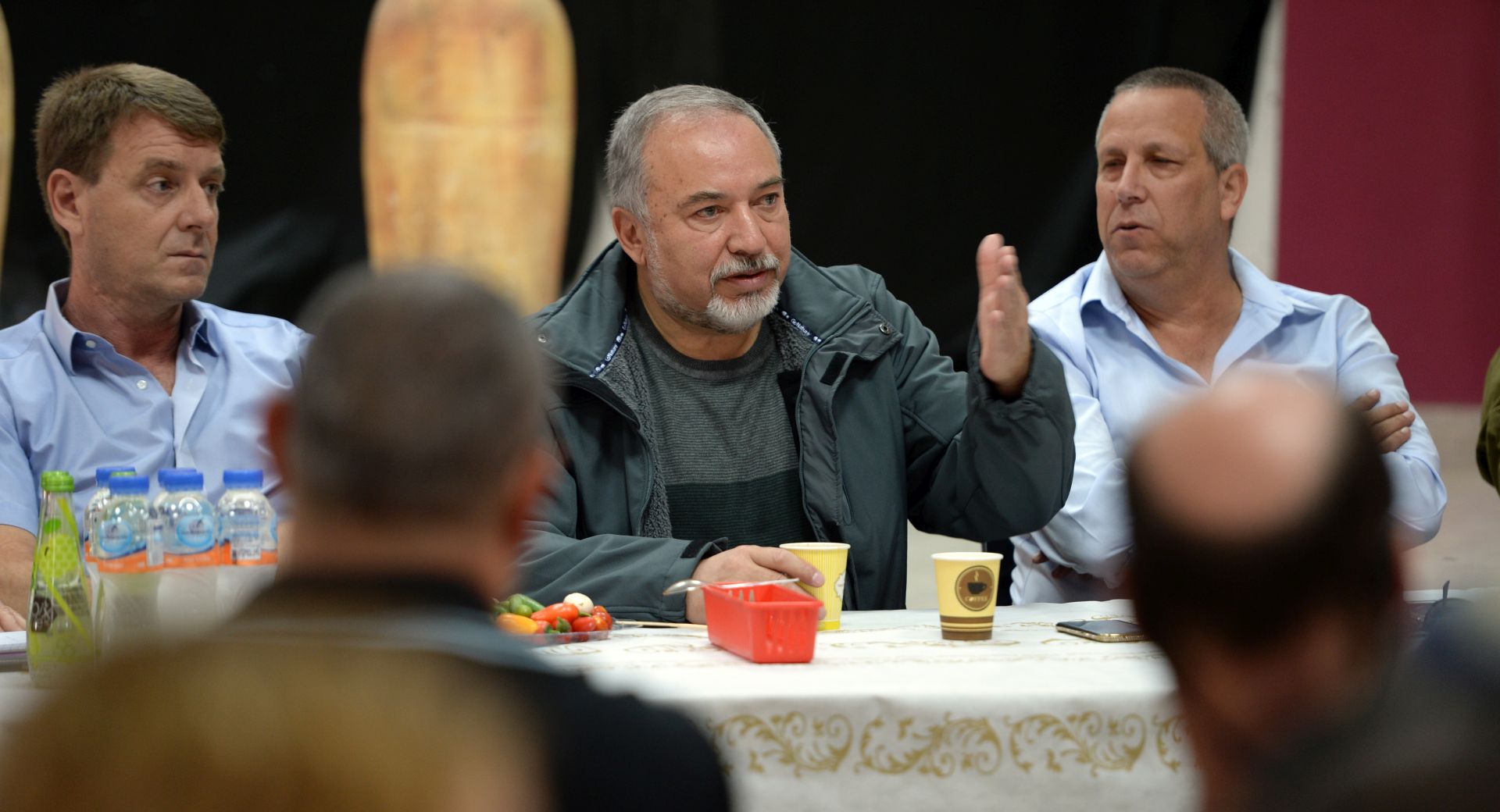 epa07120783 A handout photo made available by the Israeli Defence Ministry on 26 October 2018 shows Israeli Defence Minister Avigdor Lieberman (C) meeting with mayors and residents an the Kibbutz Kerem Shalom, southern Israel, 26 October 2018. Lieberman on 21 October 2018 ordered to reopen the Kerem Shalom and Erez border crossings in Gaza. Israelis are set vote for their mayors and city council members on 30 October.  EPA/Ariel Hermoni / HANDOUT  HANDOUT EDITORIAL USE ONLY/NO SALES