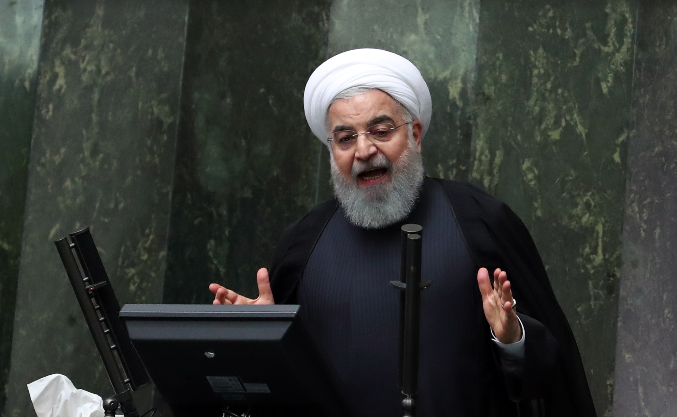 epa07124307 Iranian President Hassan Rouhani speaks to the parliament to defend his nominations for four ministries during a parliament session in Tehran, Iran, 27 October 2018. Iranian parliament will review four nominees for ministries of Economic, Labour, roads and urban, and industry and mine. Media reported that Rouhani said in his speech that US is isolated against Iran, with EU supports Iran against the US is a rare victory for Iran.  EPA/ABEDIN TAHERKENAREH