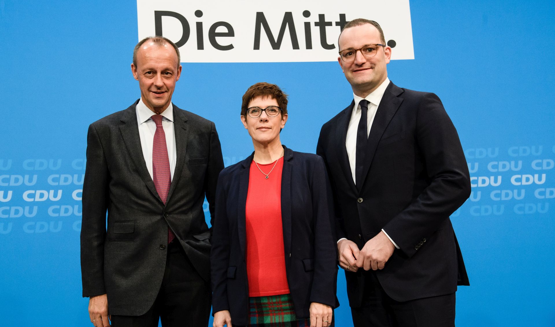 epa07153430 (L-R) The three candidates for the CDU leadership, Former Christian Democratic Union (CDU) faction leader Friedrich Merz, Christian Democratic Union (CDU) Secretary General Annegret Kramp-Karrenbauer and German Health Minister Jens Spahn pose for a photo after a media statement in Berlin, Germany, 09 November 2018. In order to present themselves, the three candidates for the CDU leadership, former Christian faction leader Friedrich Merz, Secretary General Annegret Kramp-Karrenbauer and Health Minister Jens Spahn, attended a meeting of the Women's Union of the CDU (Frauen Union der CDU).  EPA/CLEMENS BILAN