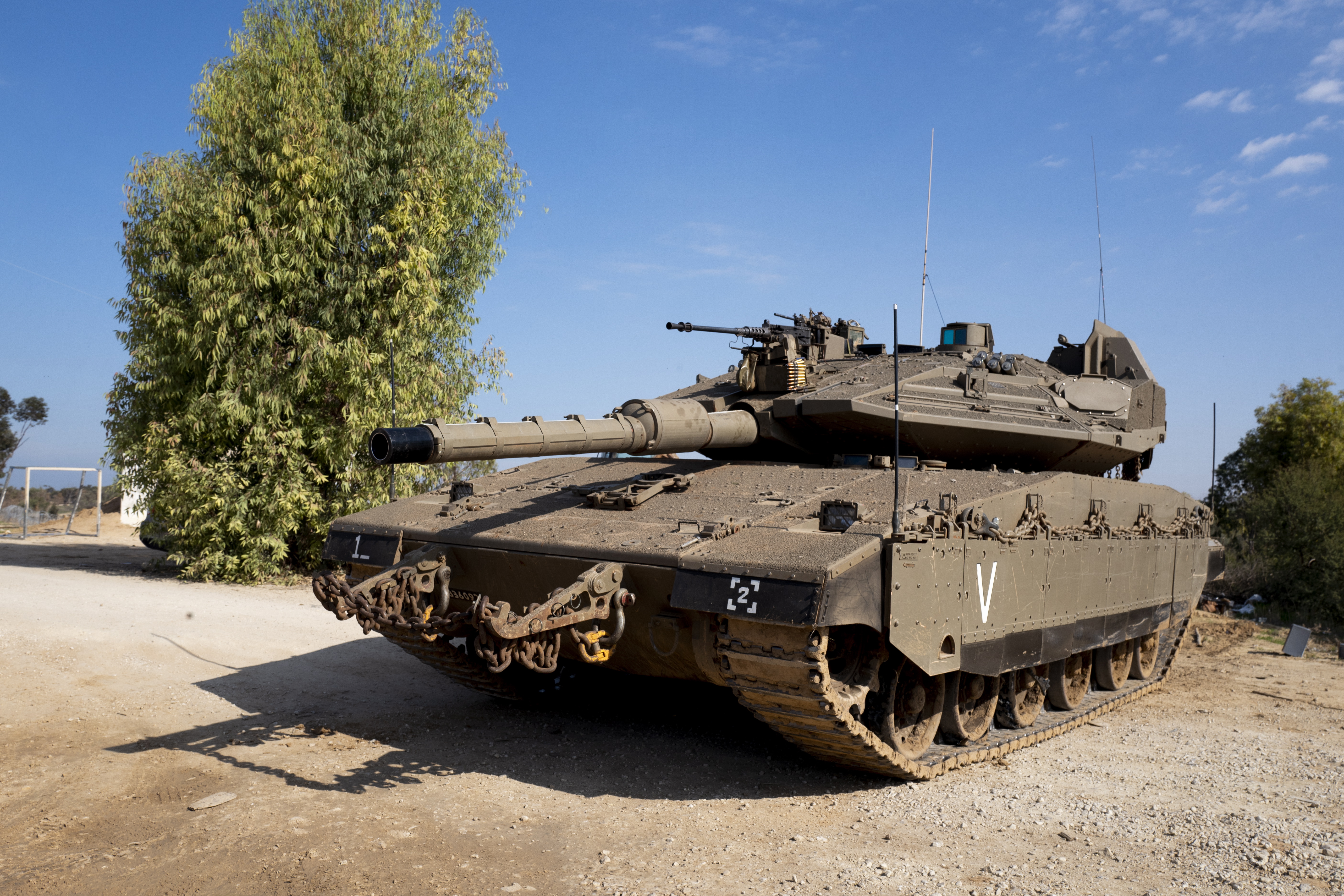 epa07162017 An Israel Defense Forces (IDF) Merkava tank on alert on a small Israeli army base along the border with the Gaza Strip, 13 November 2018. The Israeli army reports that approximately 300 missiles were launched from the Gaza Strip toward Israel in the past days, with more rockets on the morning of 13 November 2018. Dozens of missiles were intercepted by the Iron Dome aerial defense system.  EPA/JIM HOLLANDER
