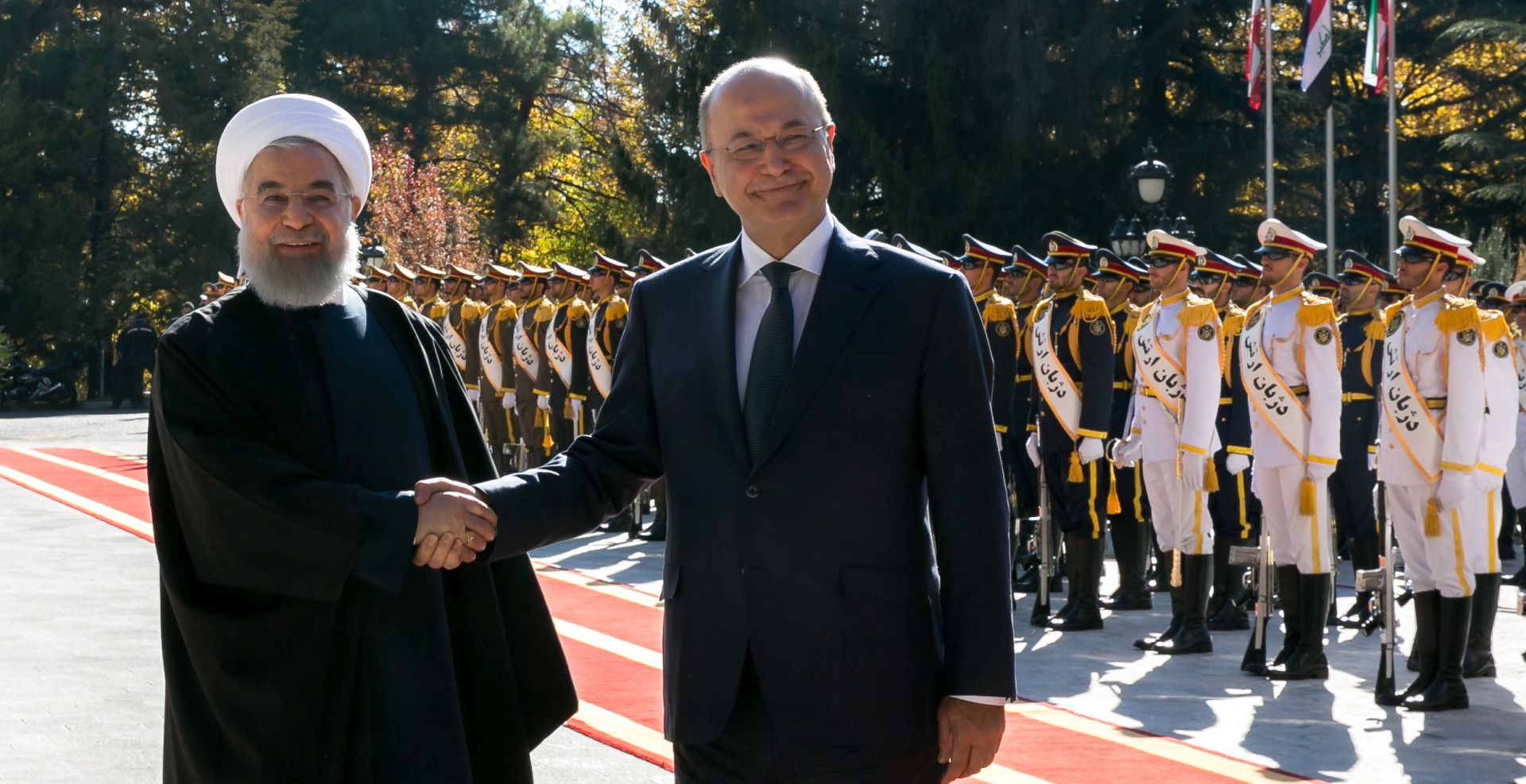 epa07171962 A handout photo made available by the Presidential Office shows Iranian president Hassan Rouhani (L) welcoming his Iraqi counterpart Barham Salih (R) in Tehran, Iran, 17 November 2018.  EPA/PRESIDENT OFFICE / HANDOUT  HANDOUT EDITORIAL USE ONLY/NO SALES