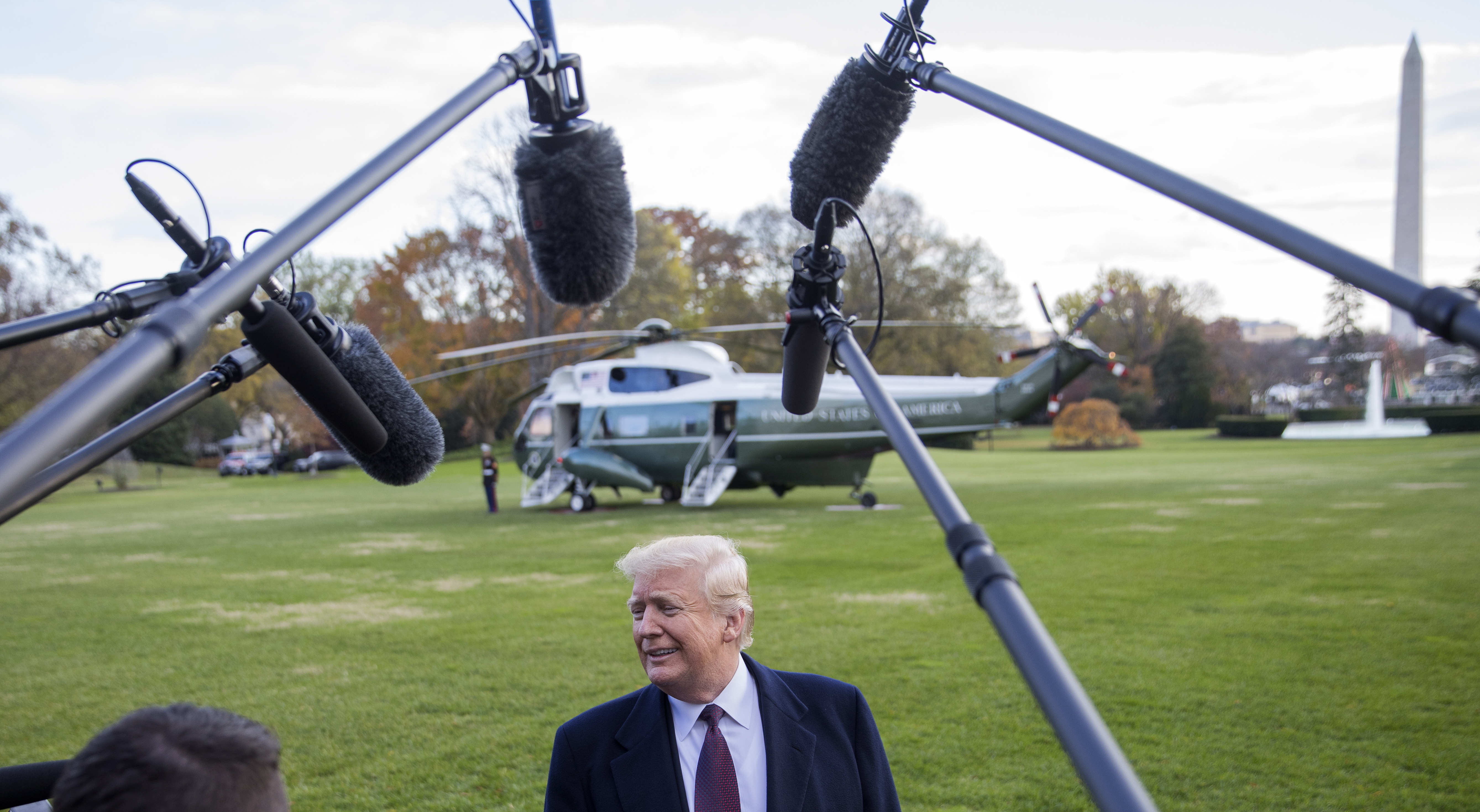 epa07180328 US President Donald J. Trump speaks to the news media before departing on Marine One with his family on the South Lawn of the White House in Washington, DC, USA, 20 November 2018. Trump is traveling to Mar-a-Lago Club in Palm Beach, Florida, for the Thanksgiving Holiday.  EPA/ERIK S. LESSER