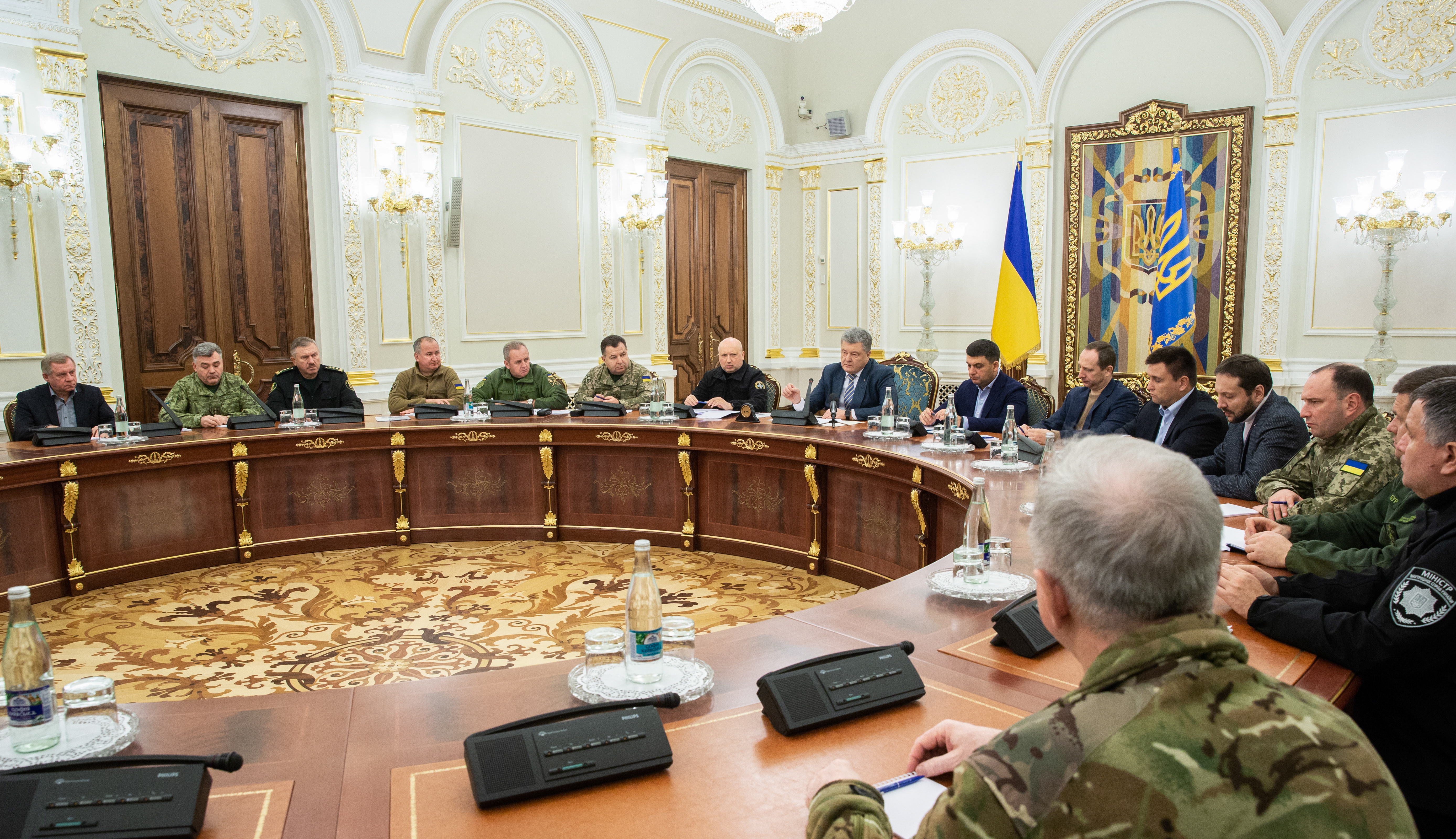epa07190230 Ukrainian President Petro Poroshenko (C) leads the National Security and Defence Council meeting in Kiev, Ukraine, 25 November 2018. Russia has seized three Ukrainian vessels amid their leaving the Kerch Strait; Ukrainian President Petro Poroshenko is gathering the Military Cabinet over the incident. The two small-sized `Berdiansk` and `Nikopol` armored artillery boats have come under enemy fire and are now dead in the water. The `Yany Kapu` tugboat has forcibly been stopped. The vessels have been captured by special forces of the Russian Federation, the press service of Ukraine`s Navy said on Facebook on Sunday evening. The Ukrainian Navy also reported the number of the Ukrainian servicemen wounded in the incident grew to two persons as Ukrainian media report.  EPA/MYKHAILO MARKIV / POOL