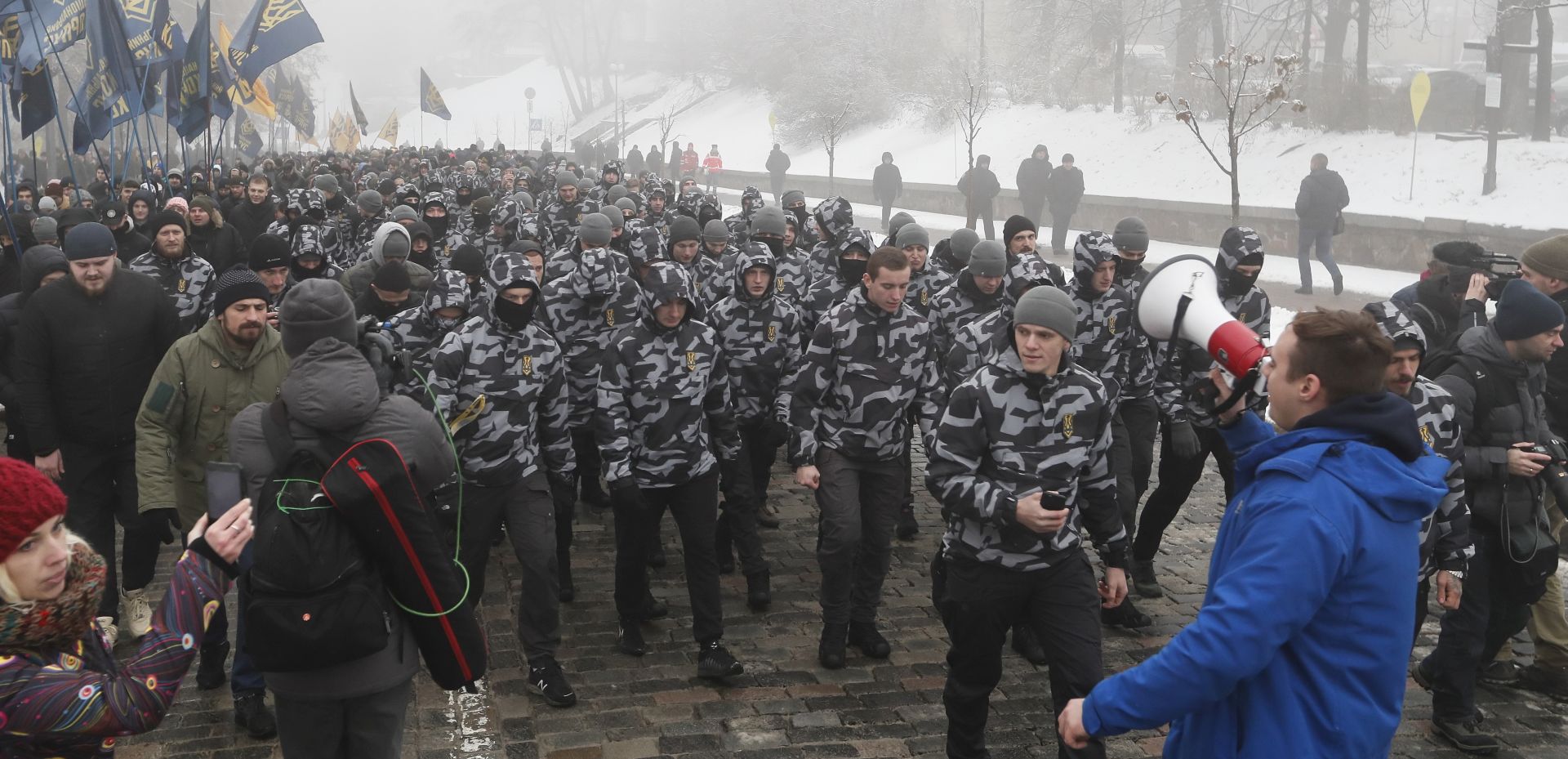 epa07190951 Ukrainian Nationalists attend a rally in front of Presidential office in Kiev, Ukraine, 26 November 2018 as they demand to break the diplomatic relations with Russia and nationalization of Russian property in Ukraine. The President of Ukraine Petro Poroshenko at a meeting of the National Security and Defense Council on 25 November 2018 announced the decision to introduce martial law in Ukraine and to appeal to the Parliament to consider the move at an extraordinary meeting. It is about the introduction of martial law for a period of 60 days. The Ukrainian Parliament will convene for an extraordinary meeting at evening 26 November 2018. Russia has seized three Ukrainian vessels amid their leaving the Kerch Strait on 25 November 2018. The two small-sized 'Berdiansk' and 'Nikopol' armored artillery boats have come under enemy fire and are now dead in the water. The 'Yany Kapu' tugboat has forcibly been stopped. The vessels have been captured by special forces of the Russian Federation, the press service of Ukraine's Navy said on Facebook on Sunday evening.  EPA/SERGEY DOLZHENKO