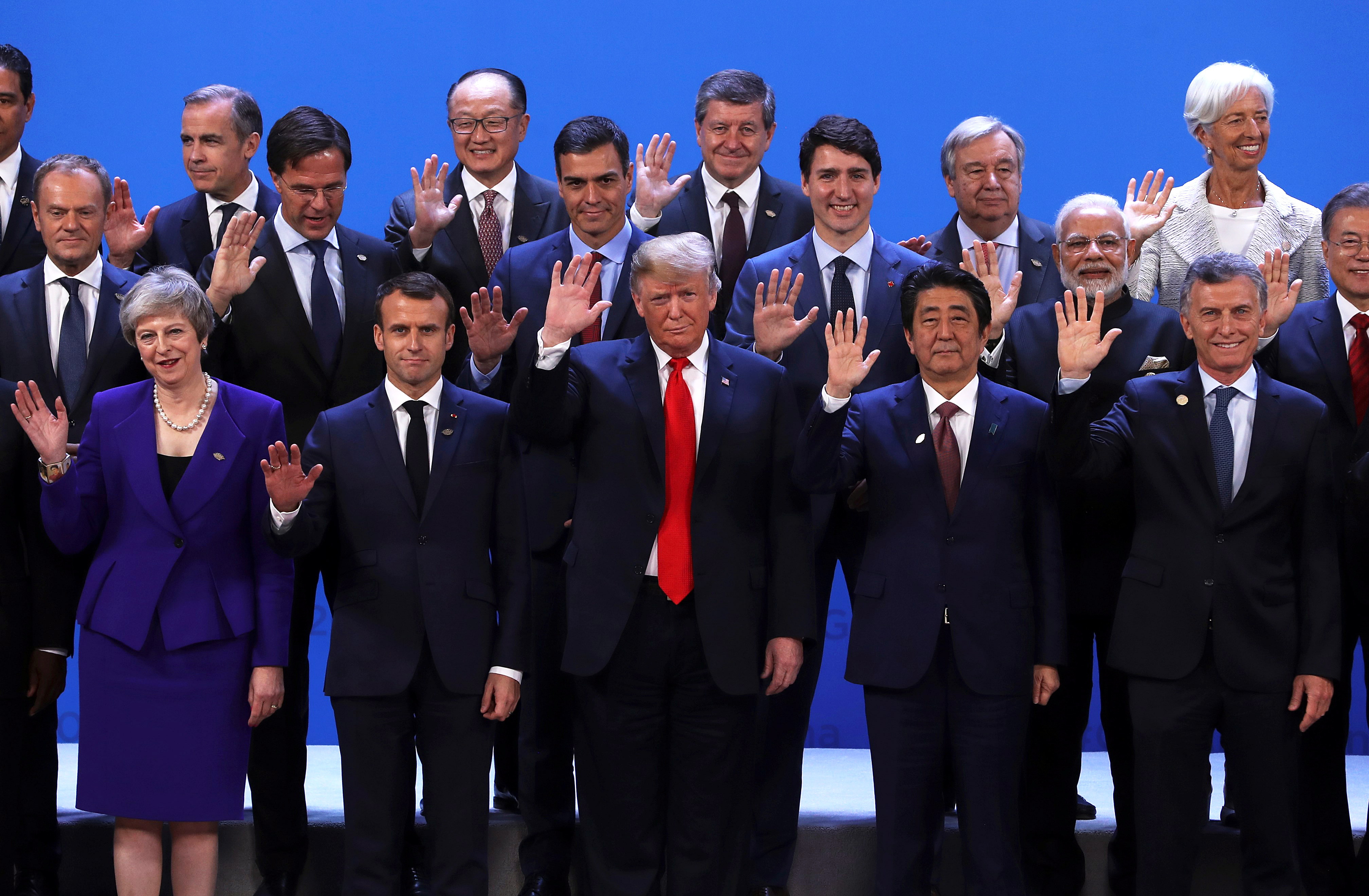 epa07199803 The Heads of State and Government of the G20 countries, including (first row L-R): British Prime Minister Theresa May, French president Emmanuel Macron, Us President Donald J. Trump, Japanese Prime Minister Shinzo Abe and Argentinian President Mauricio Macri pose for the family photography of the G20 Summit, at the Costa Salguero convention center, in Buenos Aires, Argentina, 30 November 2018. The G20 Summit brings together the heads of State or Government of the 20 largest economies and takes place from 30 November to 01 December 2018.  EPA/BALLESTEROS