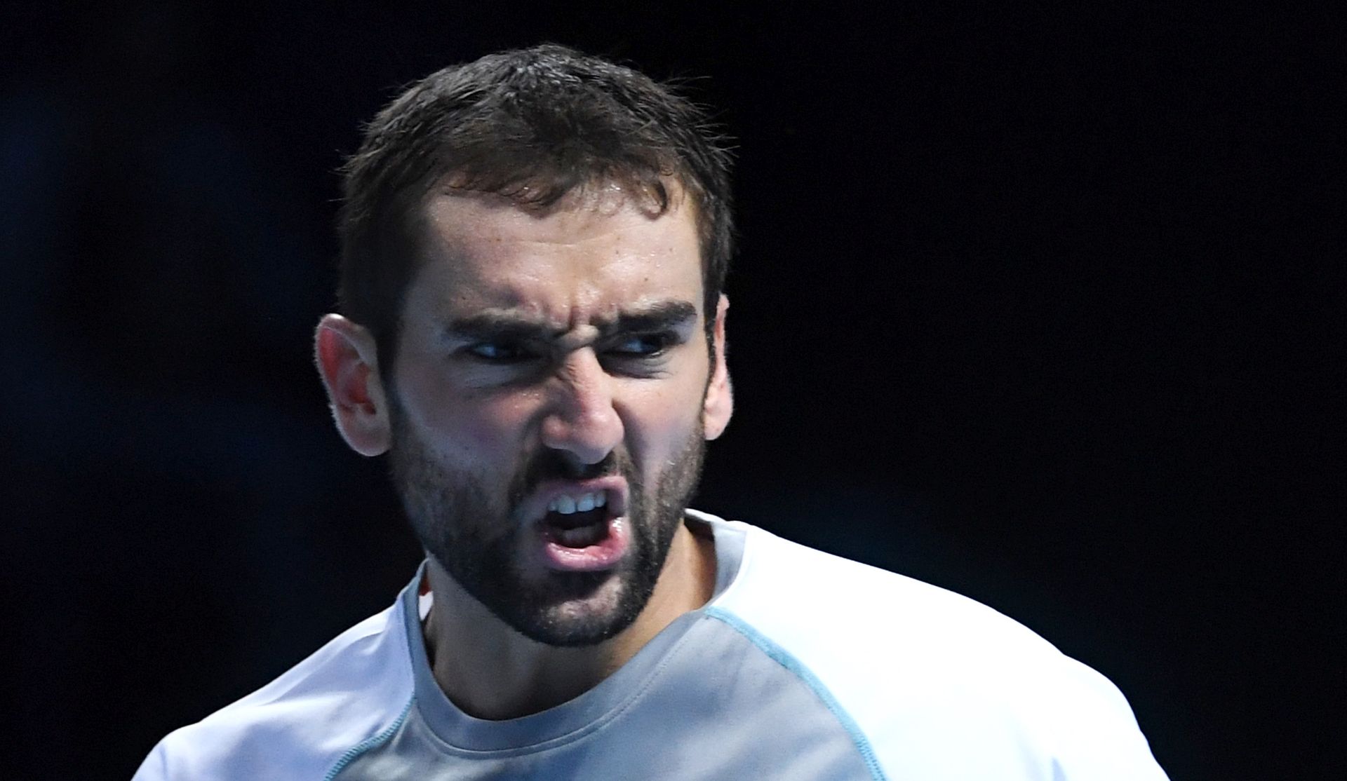 epa07161198 Croatia's Marin Cilic reacts after winning a point against Germany's Alexander Zverev during their Men's Singles Round Robin match at the ATP World Tour Finals tennis tournament at the O2 Arena in London, Britain, 12  November 2018.  EPA/FACUNDO ARRIZABALAGA