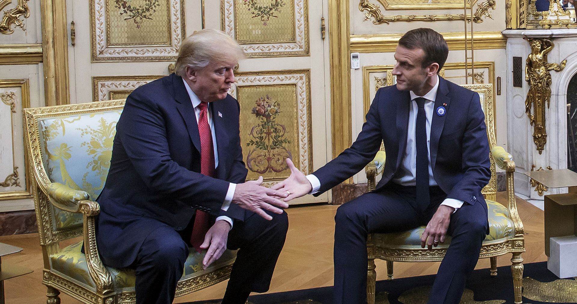 epa07154867 French President Emmanuel Macron (R) and US President Donald J. Trump (L) shake hands during their meeting at the Elysee palace in Paris, France, 10 November 2018, ahead of the international ceremony for the Centenary of the WWI Armistice of 11 November 1918. US President Trump along with other Heads of States and Governments will join on 11 November the commemoration ceremonies for their countries' fallen WW1 soldiers in France.  EPA/CHRISTOPHE PETIT TESSON / POOL