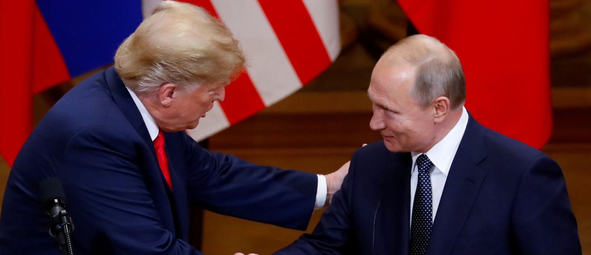 FILE PHOTO: Trump-Putin summit in Helsinki FILE PHOTO: U.S. President Donald Trump and Russian President Vladimir Putin shake hands as they hold a joint news conference after their meeting in Helsinki, Finland, July 16, 2018. REUTERS/Leonhard Foeger/File Photo Leonhard Foeger