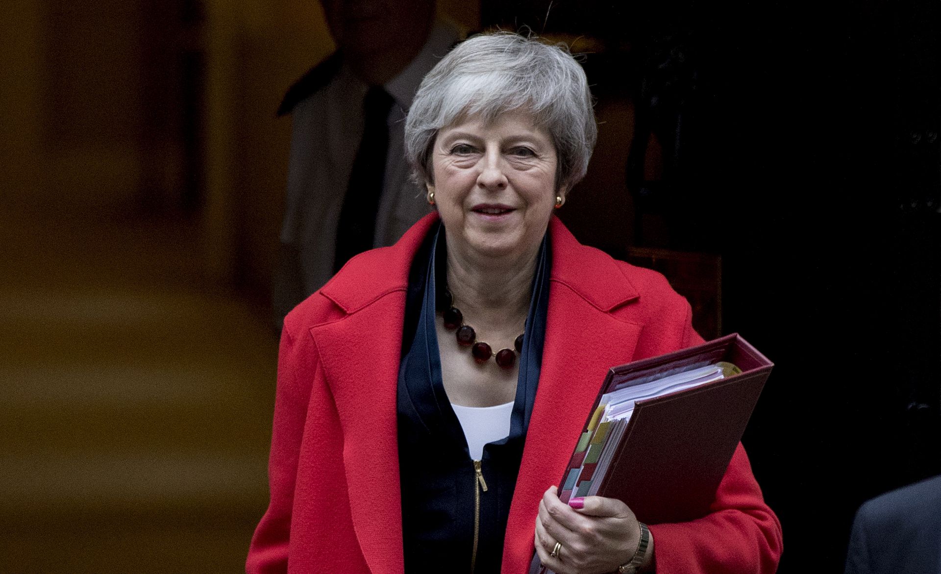 epa07194552 British Prime Minister Theresa May leaves No.10 Downing Street as she makes her way to The House of Commons for Prime Minister's Questions, Central London, Britain, 28 November 2018. Later the Prime Minister will visit Scotland as she tries to build support for her Brexit deal before the vote next month in the Commons.  EPA/RICK FINDLER