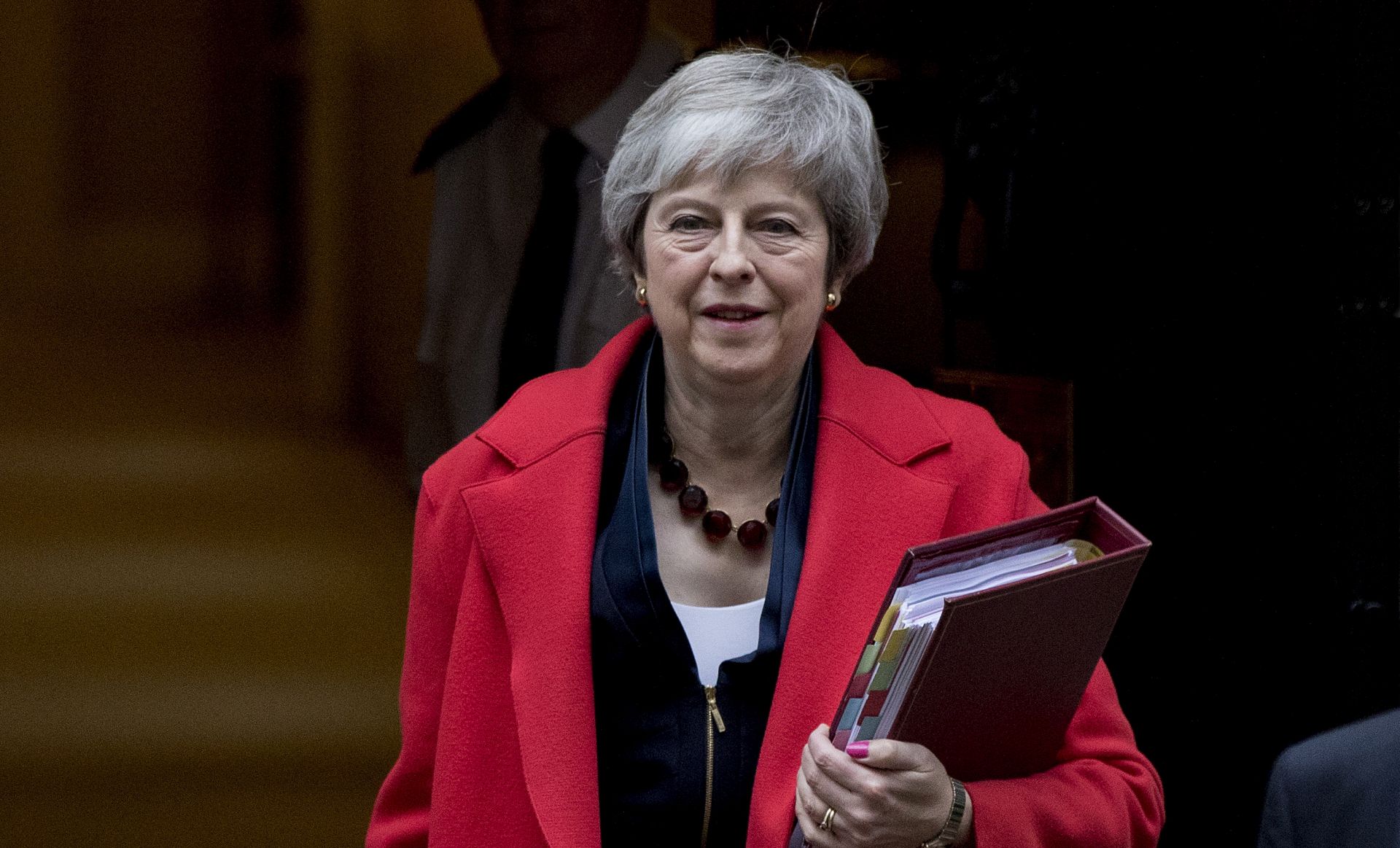epa07194552 British Prime Minister Theresa May leaves No.10 Downing Street as she makes her way to The House of Commons for Prime Minister's Questions, Central London, Britain, 28 November 2018. Later the Prime Minister will visit Scotland as she tries to build support for her Brexit deal before the vote next month in the Commons.  EPA/RICK FINDLER