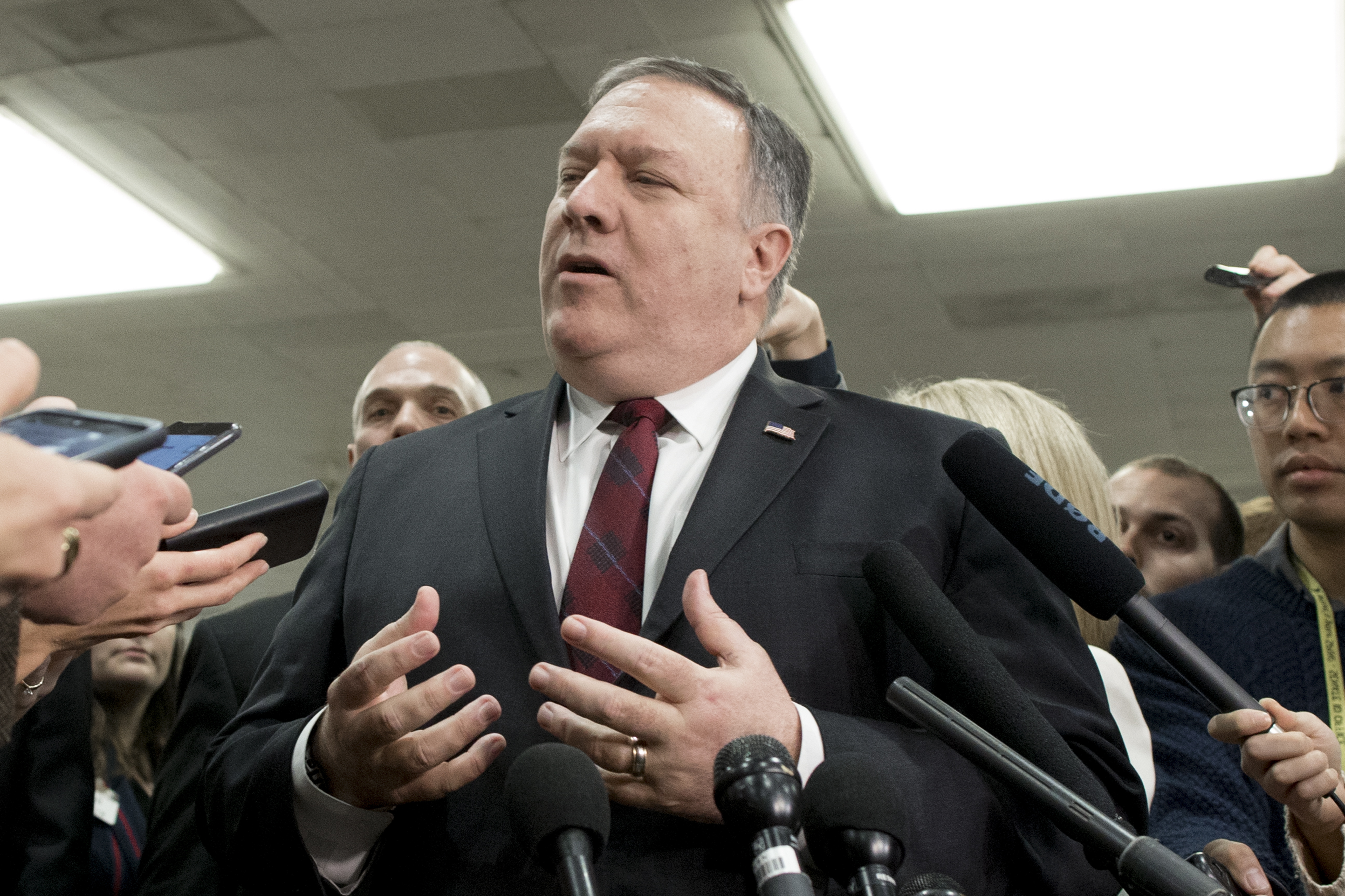 epa07195530 US Secretary of State Mike Pompeo (C) speaks to members of the news media following a closed briefing for US senators on Saudi Arabia, on Capitol Hill in Washington, DC, USA, 28 November 2018. Members of the US Senate attended a briefing by US Secretary of State Mike Pompeo and US Secretary of Defense Jim Mattis on developments relating to Saudi Arabia. The Senate is expected to consider a resolution co-sponsored by Independent Senator from Vermont Bernie Sanders and Republican Senator from Utah Mike Lee that would stop US support of Saudi Arabia's involvement in conflict in Yemen following the death of Washington Post contributor Jamal Khashoggi.  EPA/MICHAEL REYNOLDS