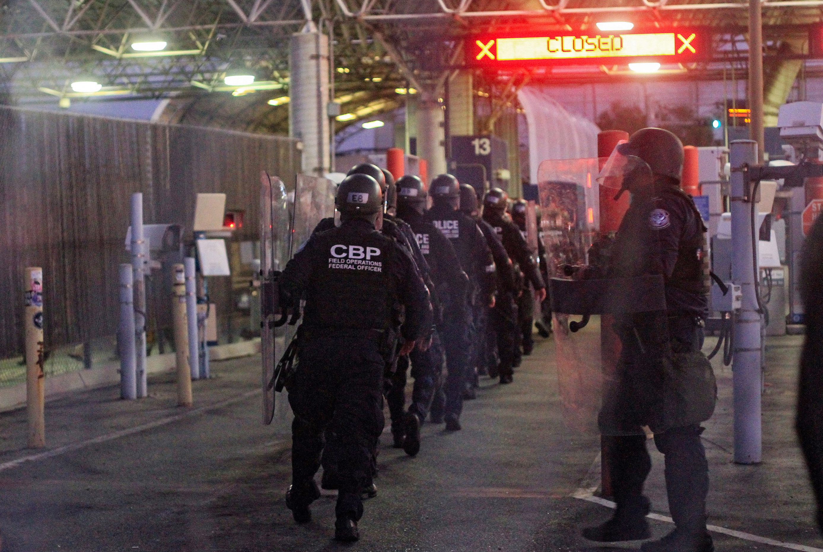 epa07202148 Members of the US Customs and Border Protection (CBP) participate in a readiness exercise at the border checkpoint Otay Mesa Port of Entry in Tijuana, Baja California, Mexico, 01 December 2018. The border between Tijuana (Mexico) and Otay Mesa (US) was closed for some 10 minutes during a readiness excercise of the US US Customs and Border Protection (CBP) forces, a week after members of the so-called migrant caravan broke the security perimeter at the Mexican side.  EPA/Joebeth Terriquez