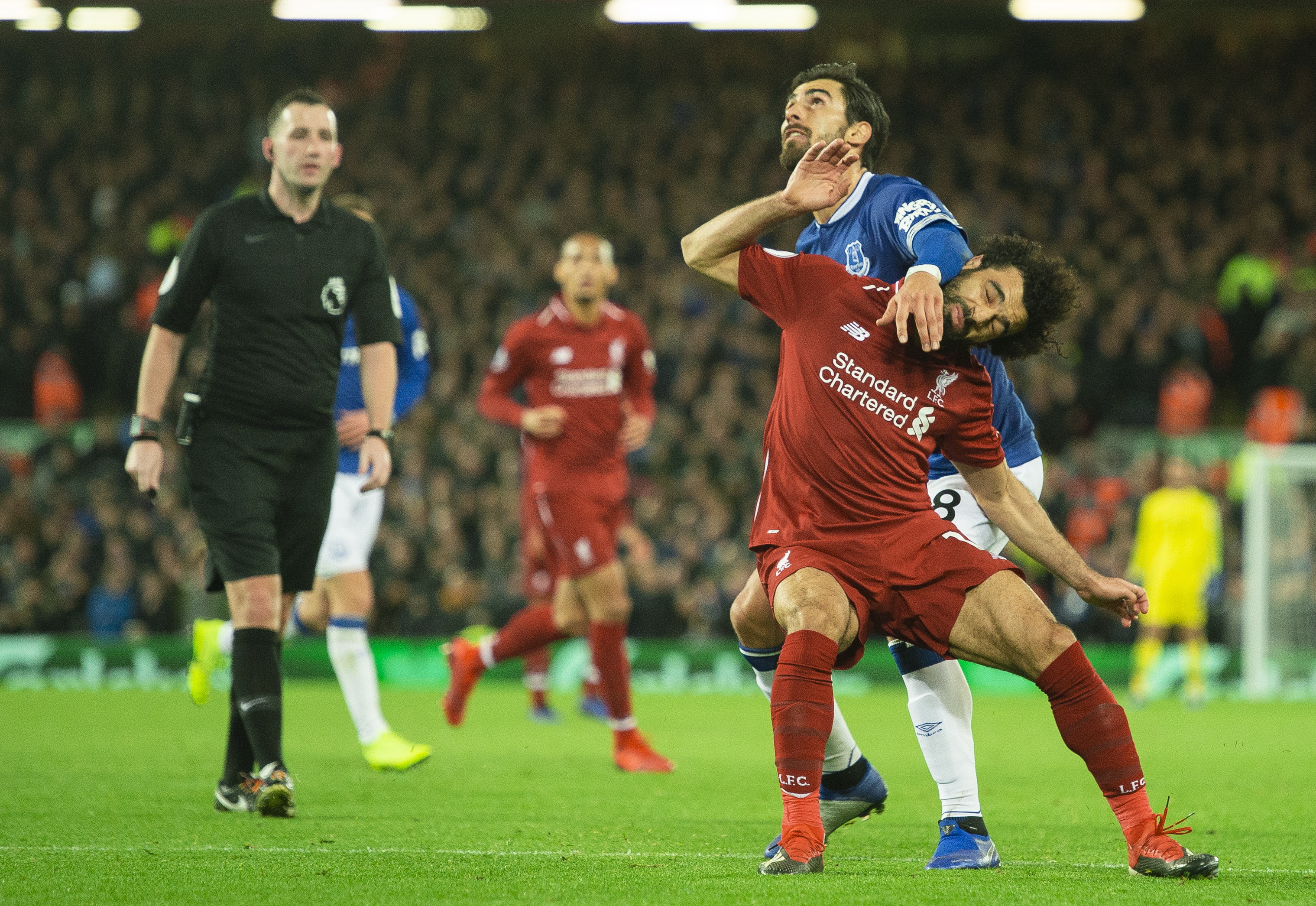 epa07204340 Liverpool's Mohamed Salah (C) in action with Everton's Andre Gomes (R) during the English Premier League soccer match between Liverpool and Everton at the Anfield in Liverpool, Britain, 02 December 2018.  EPA/PETER POWELL EDITORIAL USE ONLY. No use with unauthorized audio, video, data, fixture lists, club/league logos or 'live' services. Online in-match use limited to 75 images, no video emulation. No use in betting, games or single club/league/player publications