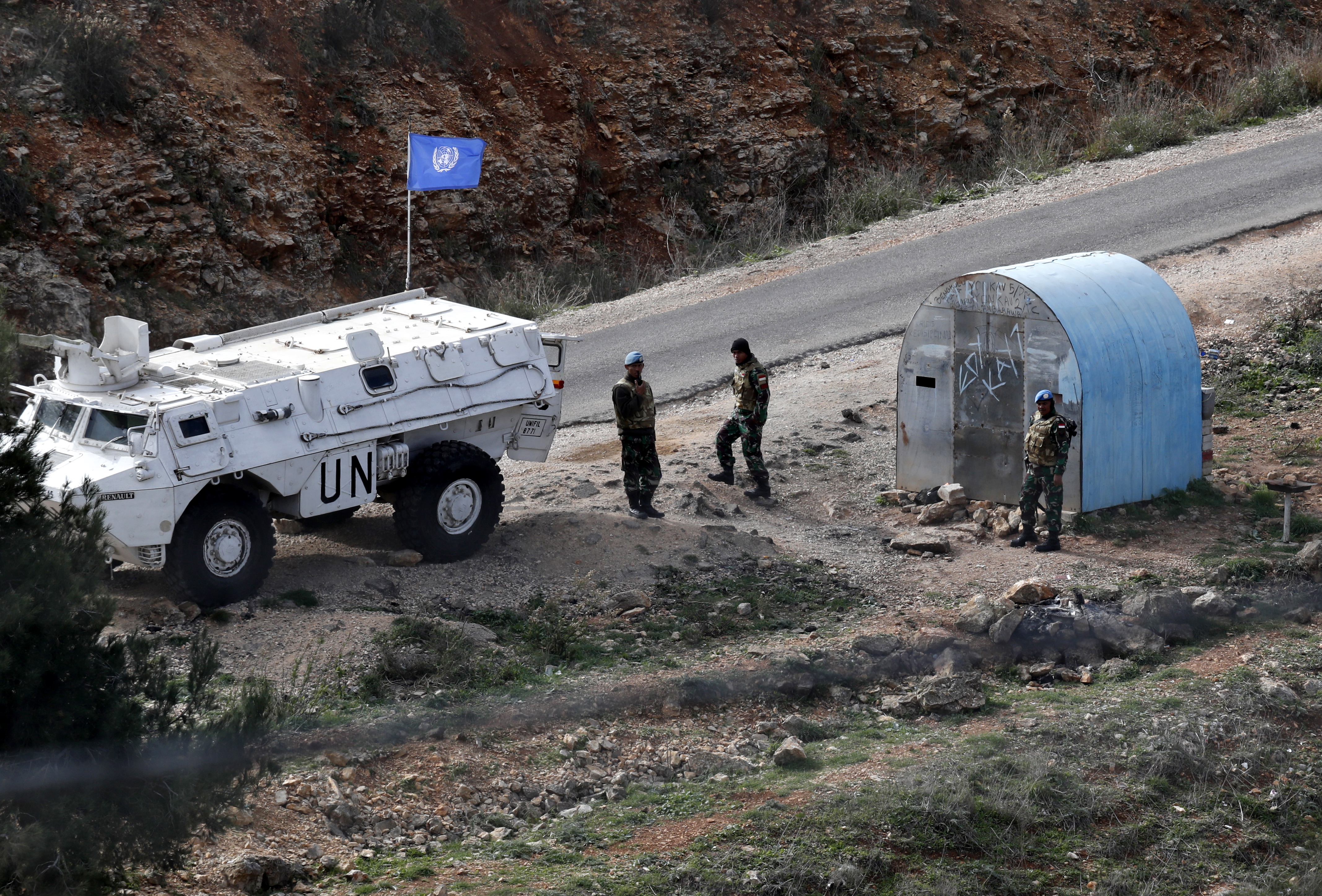 epa07209664 UN soldiers on the Lebanese side of the border, near the Israeli village of Misgav AM, on the Israel border with Lebanon, 05 December 2018. The Israeli army machinery continues working for the second day on the Israeli-Lebanese border, on the ongoing Operation called Northern Shield to destroy tunnels dug by Hezbollah crossing the Lebanon border into Israel, according to the Israeli army announcement.  EPA/ATEF SAFADI