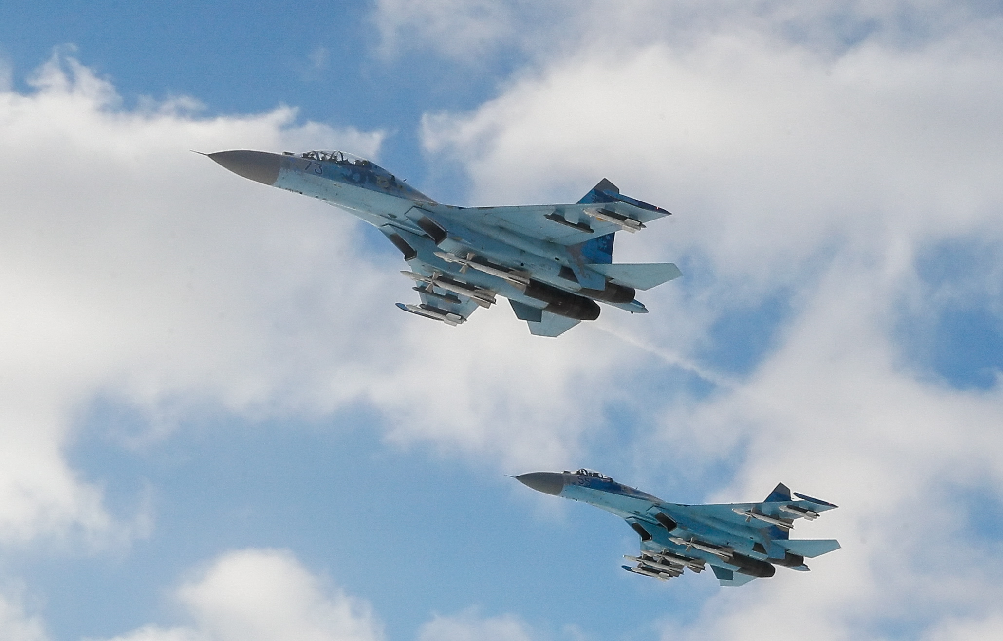 epa07212151 Two Ukrainian Su-27 fighters patrol a sky during departure of the Ukrainian paratroopers to the Eastern-Ukrainian conflict zone at the military airbase not far of Zhytomyr city, about 130 km from capital Kiev, Ukraine, 06 December 2018. Ukrainian President, Supreme Commander-in-Chief of the Armed Forces of Ukraine Petro Poroshenko on Wednesday addressed the Ukrainian soldiers ahead of Armed Forces Day, which is marked on December 6, noting that for the fifth consecutive year the military celebrate their professional holiday on the frontline of the Russian-Ukrainian war.  EPA/SERGEY DOLZHENKO