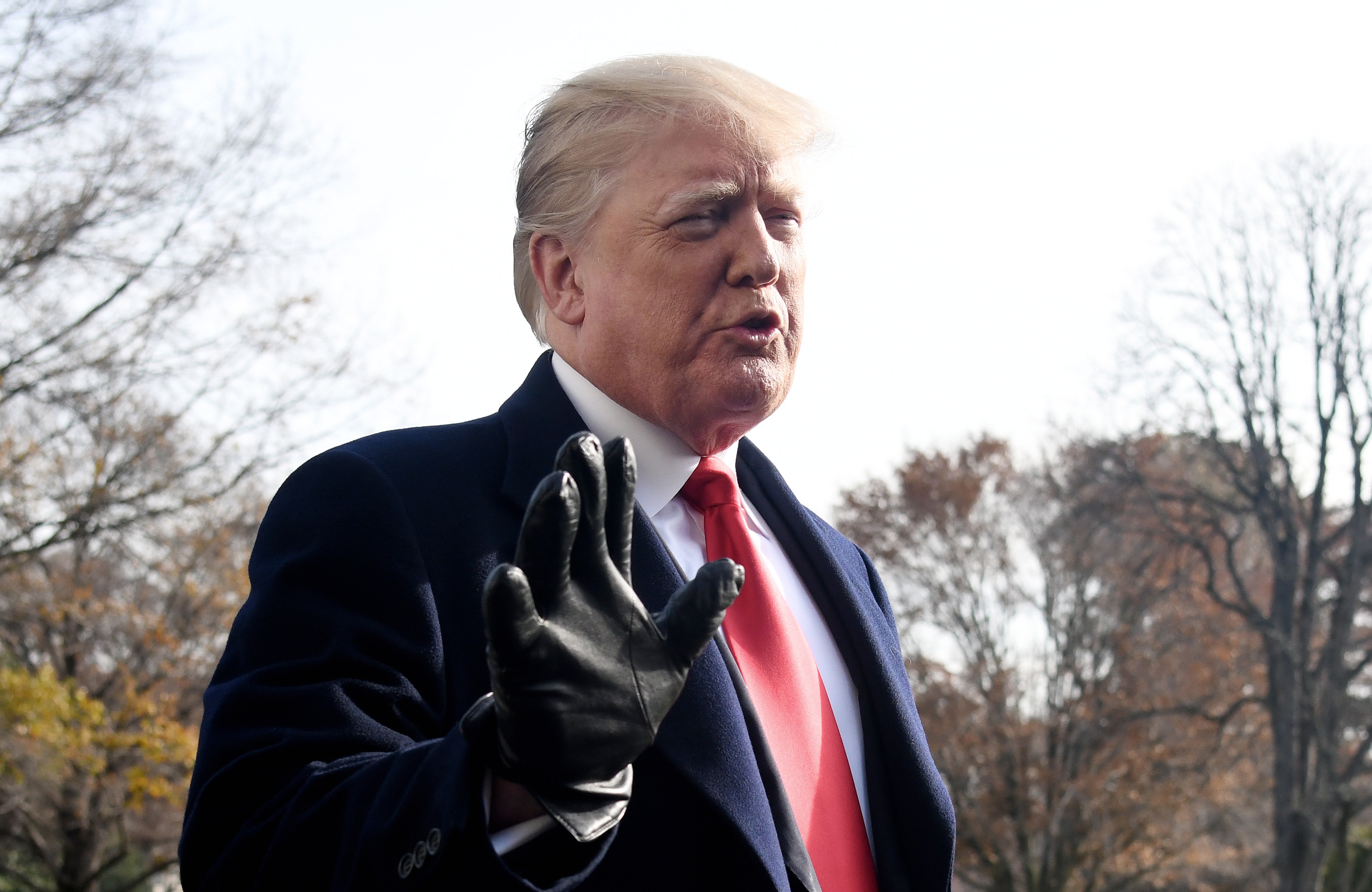 epa07218039 US President Donald J. Trump answers questions from the press while departing the White House in Washington, DC, USA, 08 December 2018. Trump said White House chief of staff John Kelly will resign by the end of the year, before departing for the 119th Army-Navy Football Game in Philadelphia, PA.  EPA/Olivier Douliery / POOL