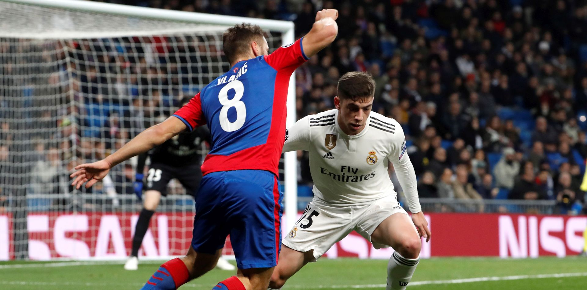 epa07226575 Real Madrid's midfielder Federico Valverde (R) vies for the ball against CSKA Moscow's midfielder Nikola Vlasic during the UEFA Champions League group G match between Real Madrid and CSKA Moscow at Santiago Bernabeu stadium in Madrid, Spain, 12 December 2018.  EPA/J.P. Gandul