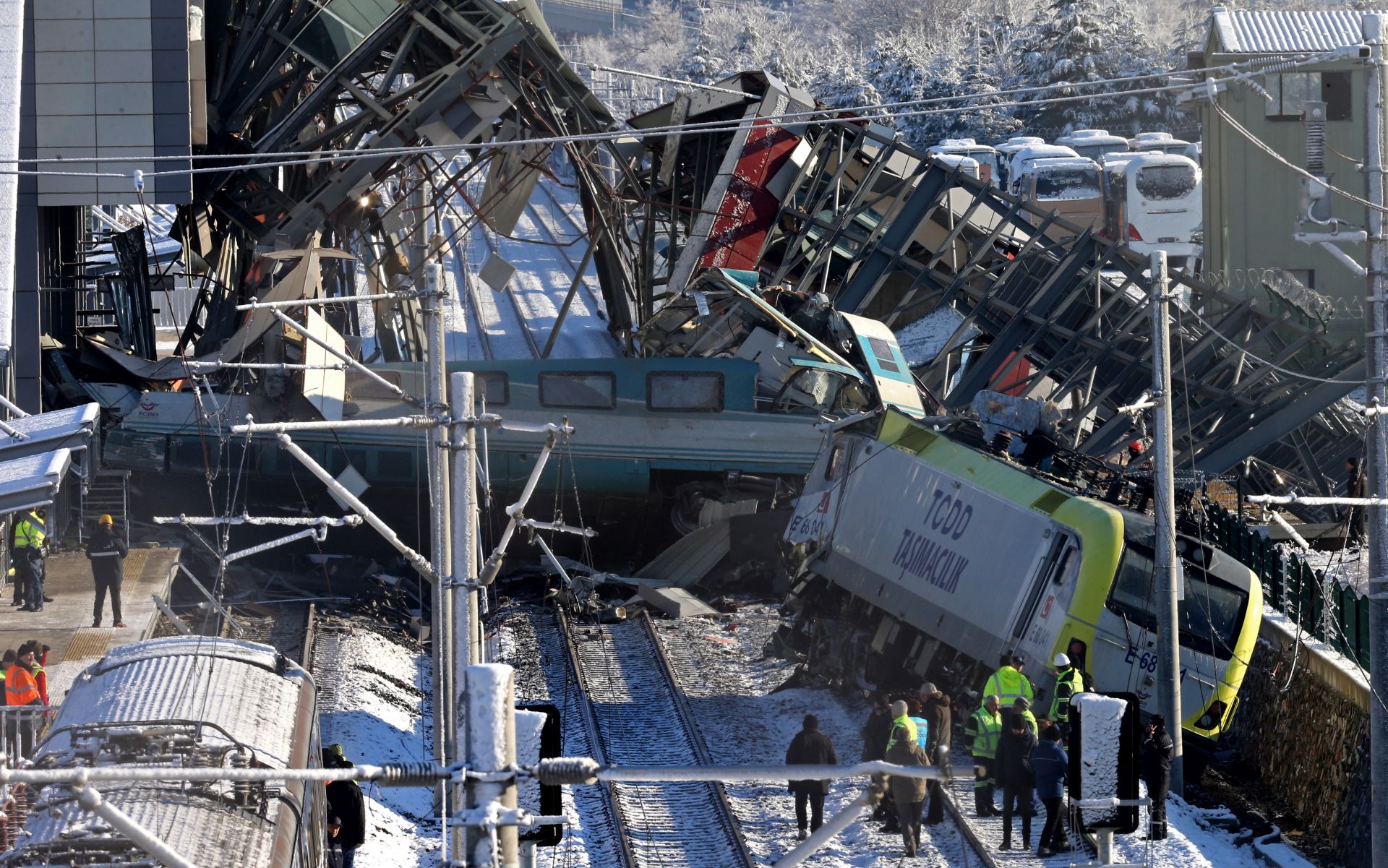 epa07227512 Firefighters and medics try to rescue victims after a high speed train accident in Ankara, Turkey, 13 December 2018. According to reports, at least four people were killed and over 40 were wounded in the accident. The crash was caused by a collision with a local train, Ankara Governor Vasip Sahin said. The train was travelling between the capital, Ankara, and the central Turkish province of Konya, local media reported.  EPA/STRINGER