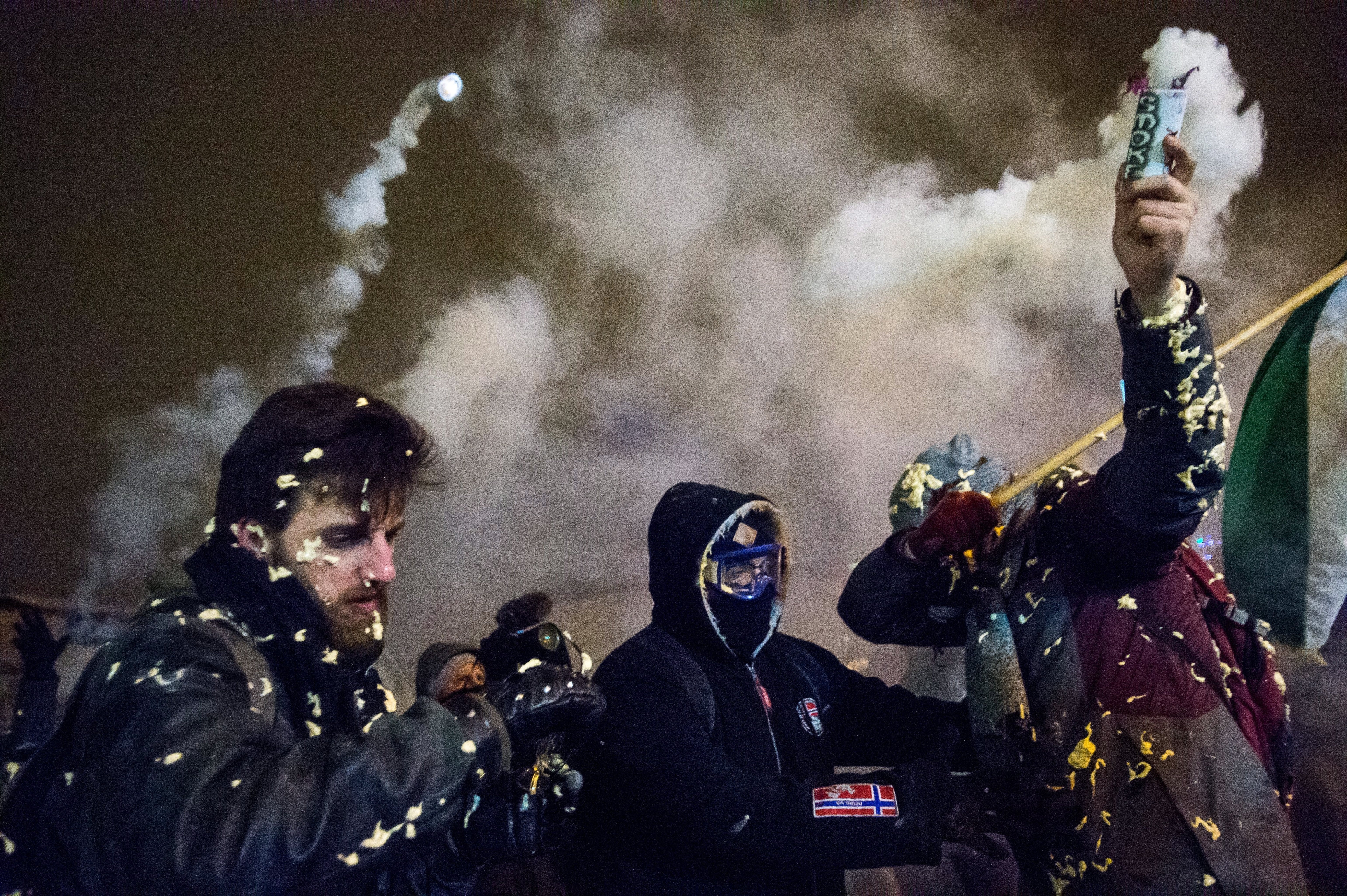 epa07232262 Demonstrators rally at the Parliament building during an anti-government demonstration in Budapest, Hungary, late 14 December 2018 (issued 15 December 2018). Three demonstrators attacking the police line were arrested during the protest, which was held for the third day in a row against changes to the labor code adopted on 12 December.  EPA/ZOLTAN BALOG HUNGARY OUT