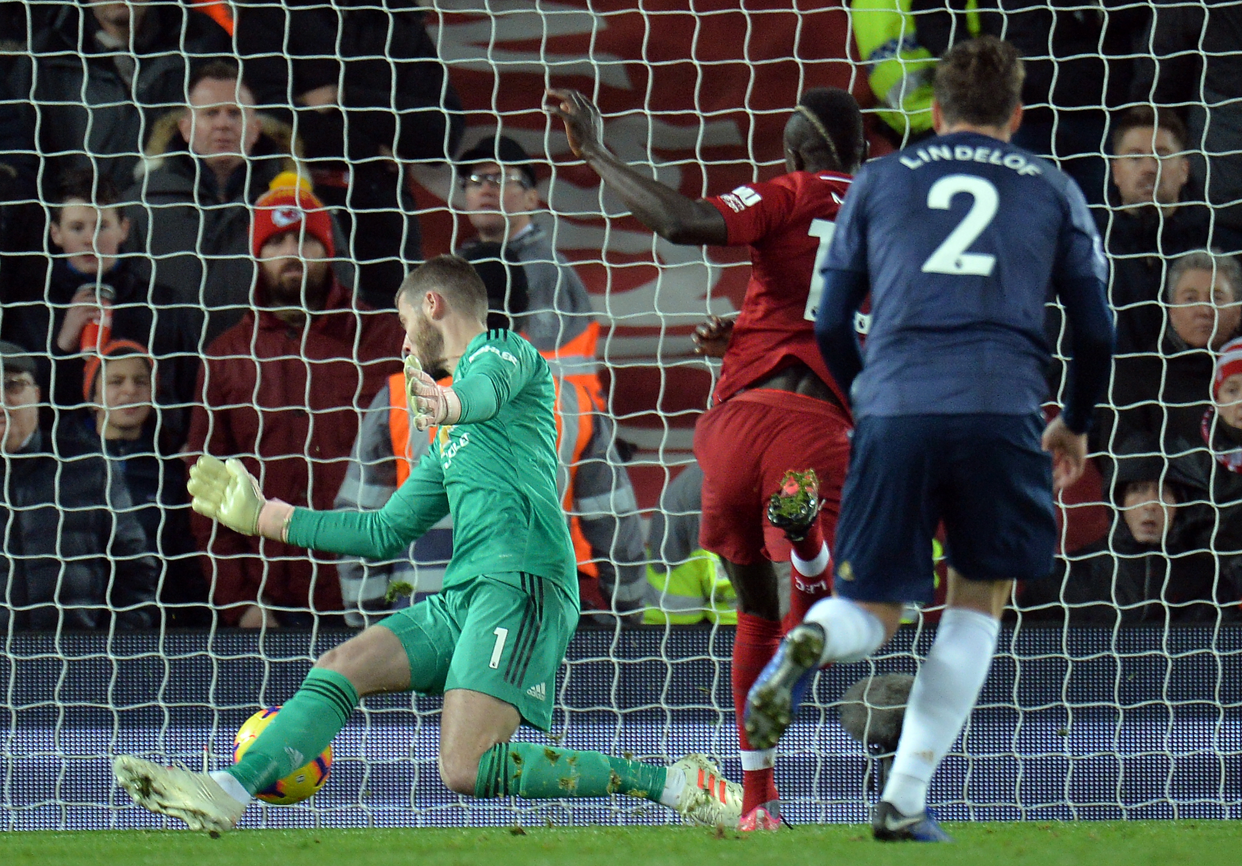 epa07235832 Sadio Mane of Liverpool (C) scores during the English Premier League soccer match between Liverpool FC and Manchester United FC at Anfield in Liverpool, Britain, 16 December 2018.  EPA/PETER POWELL EDITORIAL USE ONLY. No use with unauthorized audio, video, data, fixture lists, club/league logos or 'live' services. Online in-match use limited to 120 images, no video emulation. No use in betting, games or single club/league/player publications.