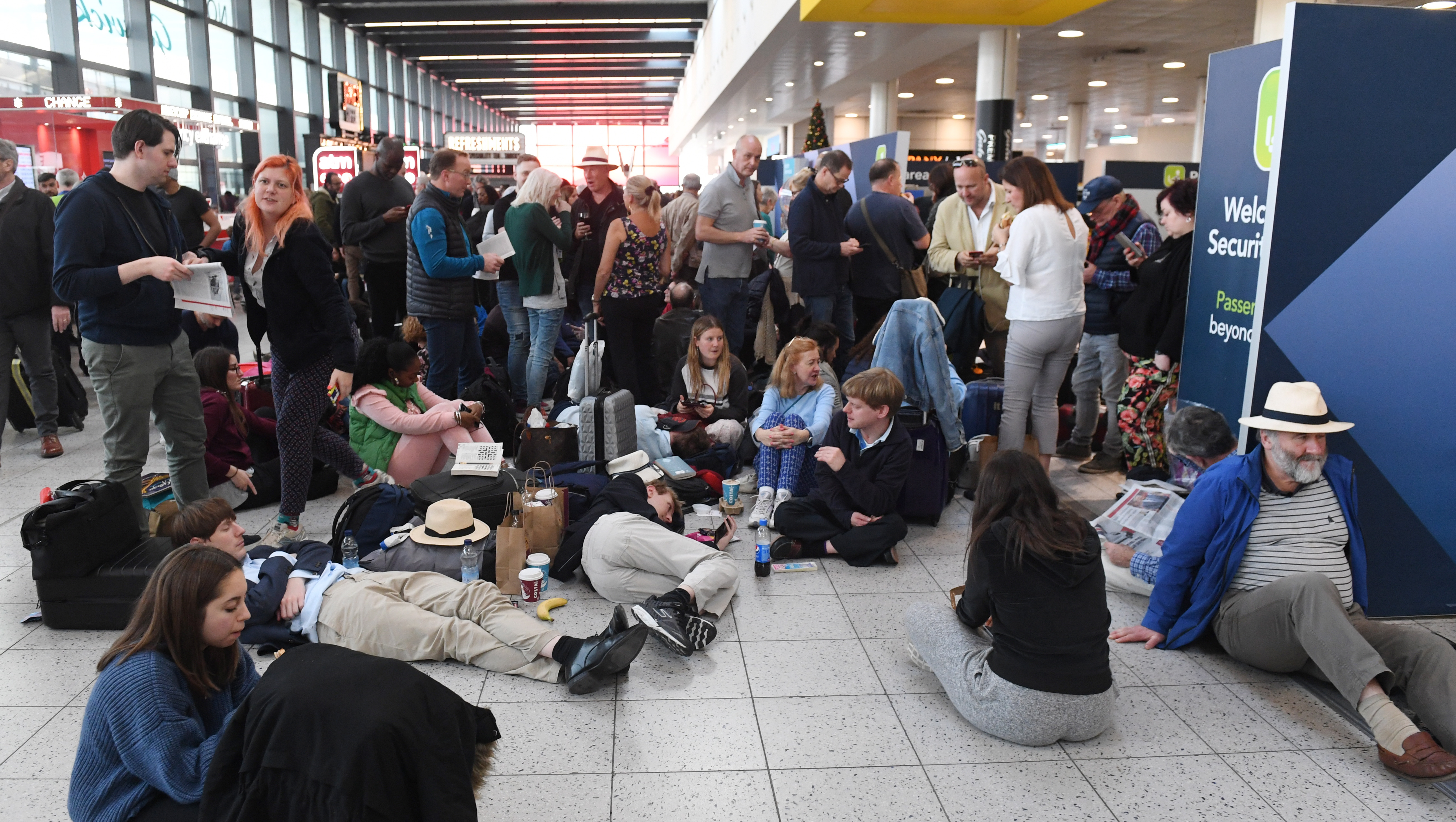 epa07242327 Passengers wait within Gatwick airport in Sussex, southeast, England, 20 December 2018. According to media reports, the runway for Britain's second busiest airport Gatwick was shut down by authorities after sightings of drones flying near the area. The incident disrupted air traffic and caused the suspension of all flights in and out of the airfield, with 110,000 passengers on 760 flights were due to fly from Gatwick.  EPA/FACUNDO ARRIZABALAGA