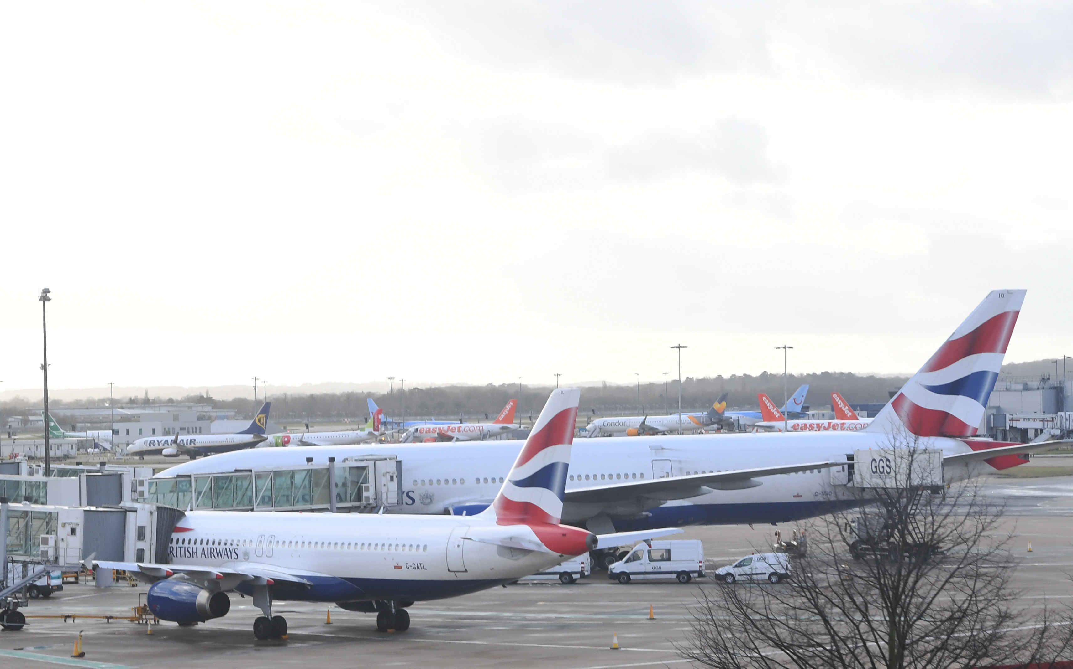 epa07242326 Planes are grounded on Gatwick airport in Sussex, southeast, England, 20 December 2018. According to media reports, the runway for Britain's second busiest airport Gatwick was shut down by authorities after sightings of drones flying near the area. The incident disrupted air traffic and caused the suspension of all flights in and out of the airfield, with 110,000 passengers on 760 flights were due to fly from Gatwick.  EPA/FACUNDO ARRIZABALAGA