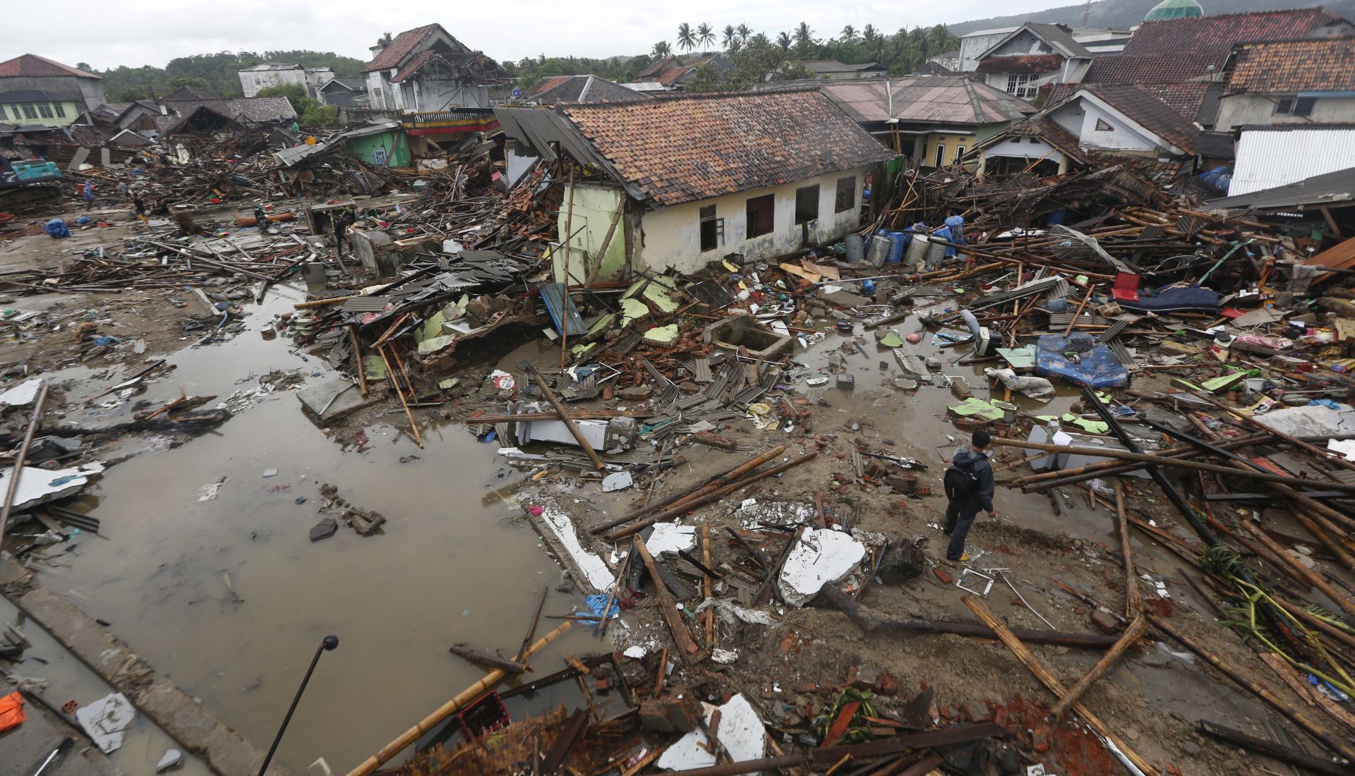 epa07247327 Debris is seen in a devastated area after a tsunami hit Sunda Strait in Sumur, Banten, Indonesia, 24 December 2018. According to the Indonesian National Board for Disaster Management (BNPB), at least 281 people died and 1,016 others have been injured after a tsunami hit the coastal regions of the Sunda Strait on 22 December.  EPA/ADI WEDA