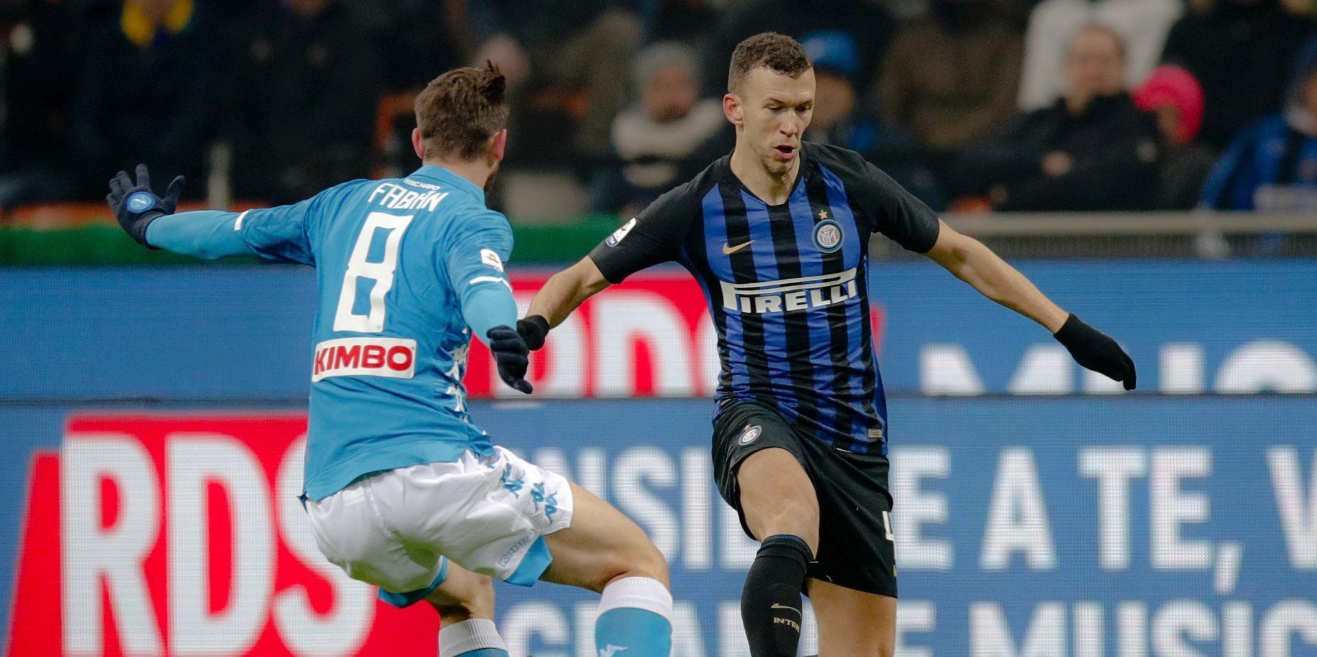 epa07249641 FC Inter's forward Ivan Perisic against Napoli's midfielder Fabian Ruiz (L) during the Italian Serie A soccer match between FC Inter and SSC Napoli at Giuseppe Meazza stadium in Milan, Italy, 26 December 2018.  EPA/Roberto Bregani