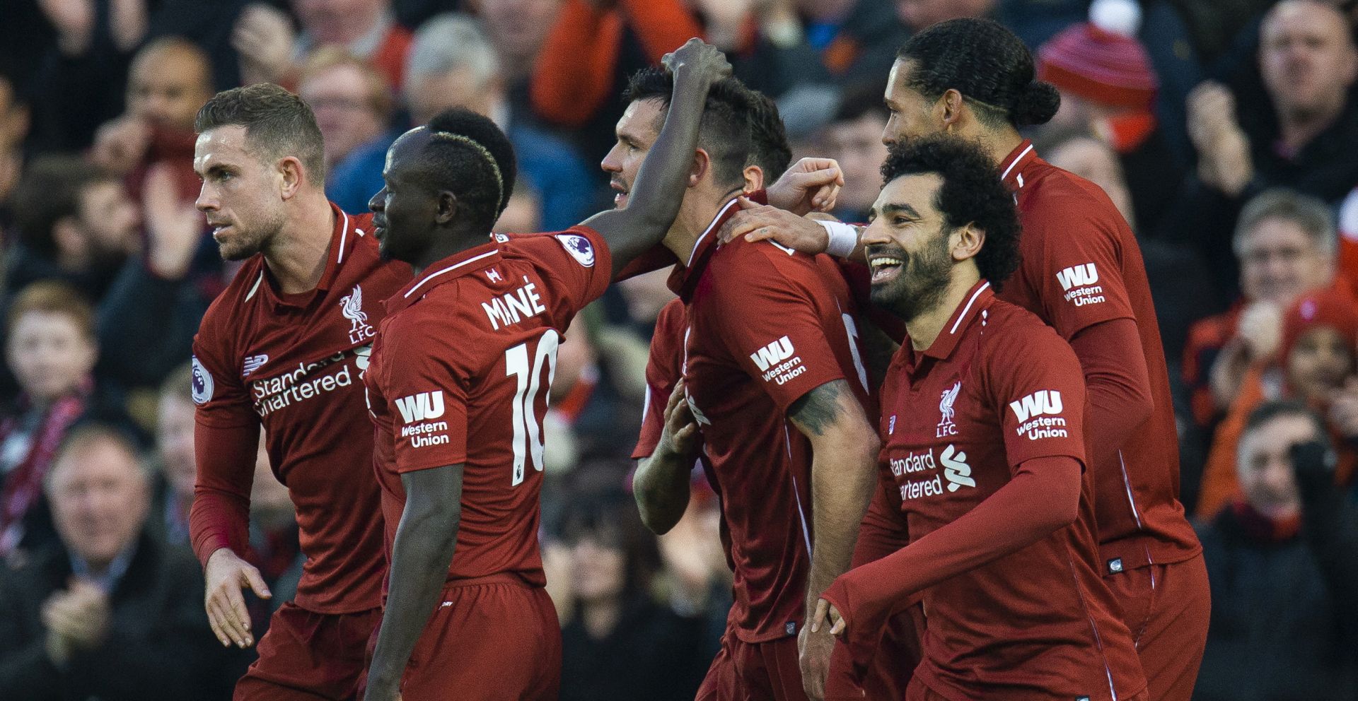 epa07249153 Liverpool's Dejan Lovren is congratulated by his teammates after scoring the opening goal during the English Premier League soccer match between Liverpool and Newcastle United at the Anfield in Liverpool, Britain, 26 December 2018.  EPA/PETER POWELL EDITORIAL USE ONLY. No use with unauthorized audio, video, data, fixture lists, club/league logos or 'live' services. Online in-match use limited to 120 images, no video emulation. No use in betting, games or single club/league/player publications