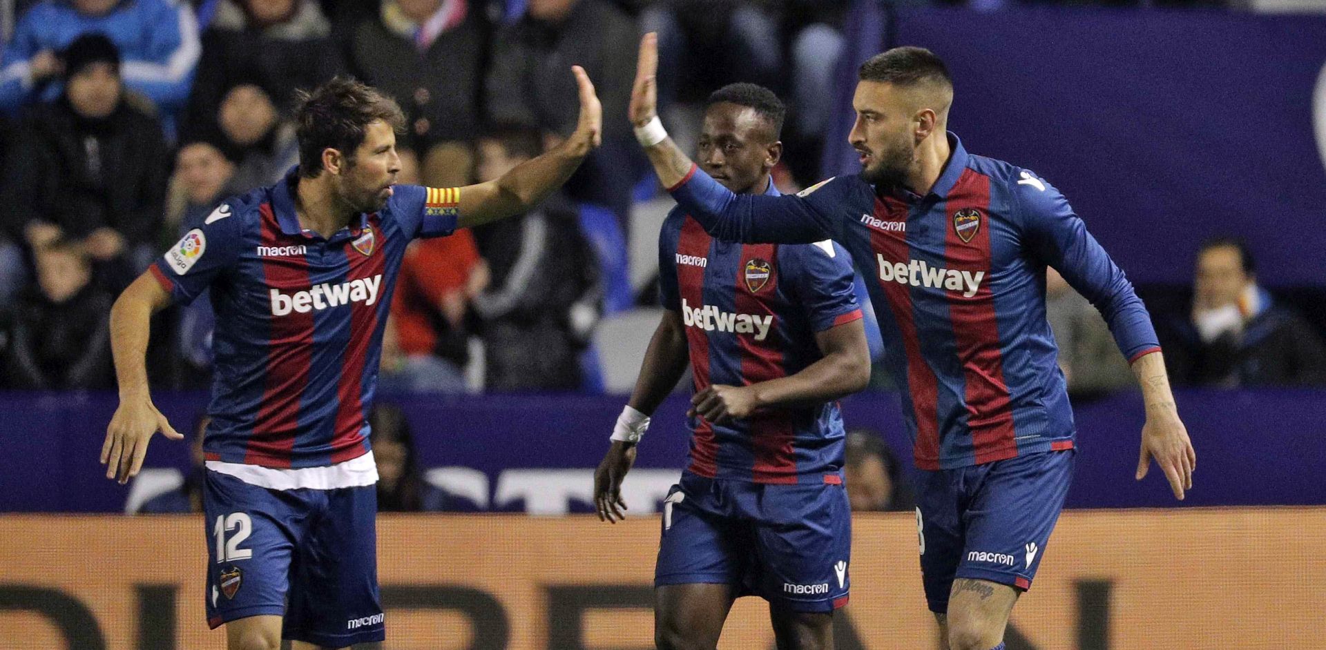epa07273995 Levante UD's Uruguayan defender Erick Cabaco (R) celebrates with teammate Coke Andujar (L) after scoring the 1-0 lead during a Spanish King's Cup round of 16 soccer match between Levante UD and FC Barcelona at the Ciutat de Valencia stadium in Valencia, Spain, 10 January 2019.  EPA/MANUEL BRUQUE