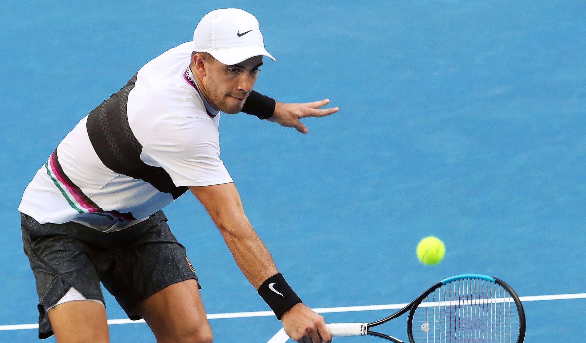 epa07305291 Borna Coric of Croatia in action against Lucas Pouille of France during their men's singles fourth round match at the Australian Open Grand Slam tennis tournament in Melbourne, Australia, 21 January 2019.  EPA/DAVID CROSLING AUSTRALIA AND NEW ZEALAND OUT