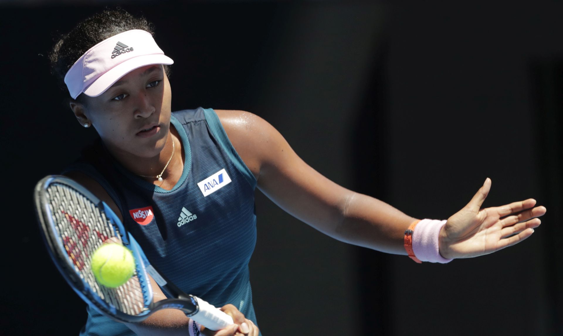 epa07304709 Naomi Osaka of Japan in action against Anastasija Sevastova of Latvia during their round four womenâ€™s singles match at the Australian Open Grand Slam tennis tournament in Melbourne, Australia, 21 January 2019.  EPA/MAST IRHAM