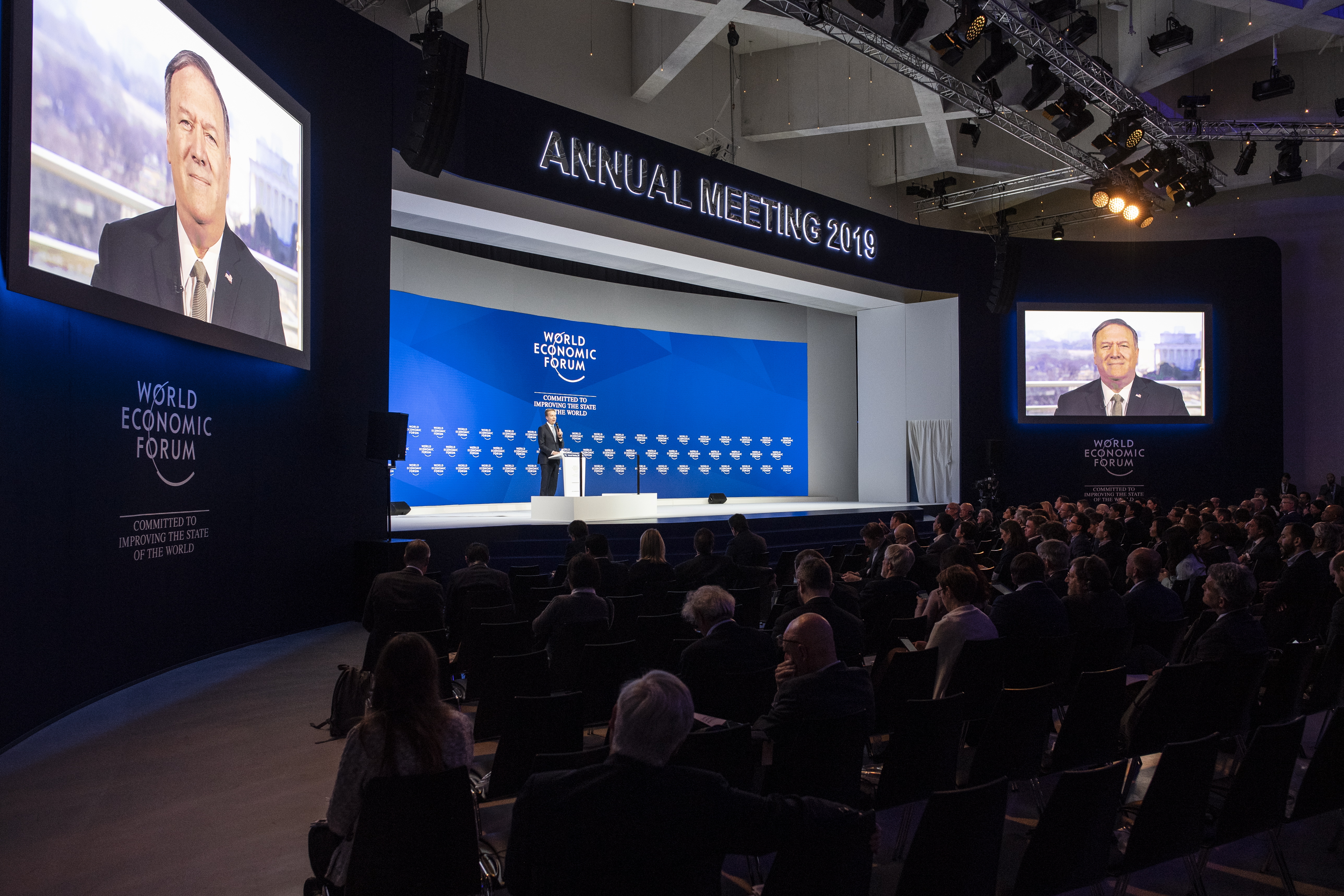 epa07309470 Michael Pompeo, US Secretary of State, speaks via video transmission during a plenary session in the Congress Hall of the 49th annual meeting of the World Economic Forum, WEF, in Davos, Switzerland, 22 January 2019. The meeting brings together entrepreneurs, scientists, corporate and political leaders in Davos under the topic 'Globalization 4.0' from 22 - 25 January 2019.  EPA/GIAN EHRENZELLER