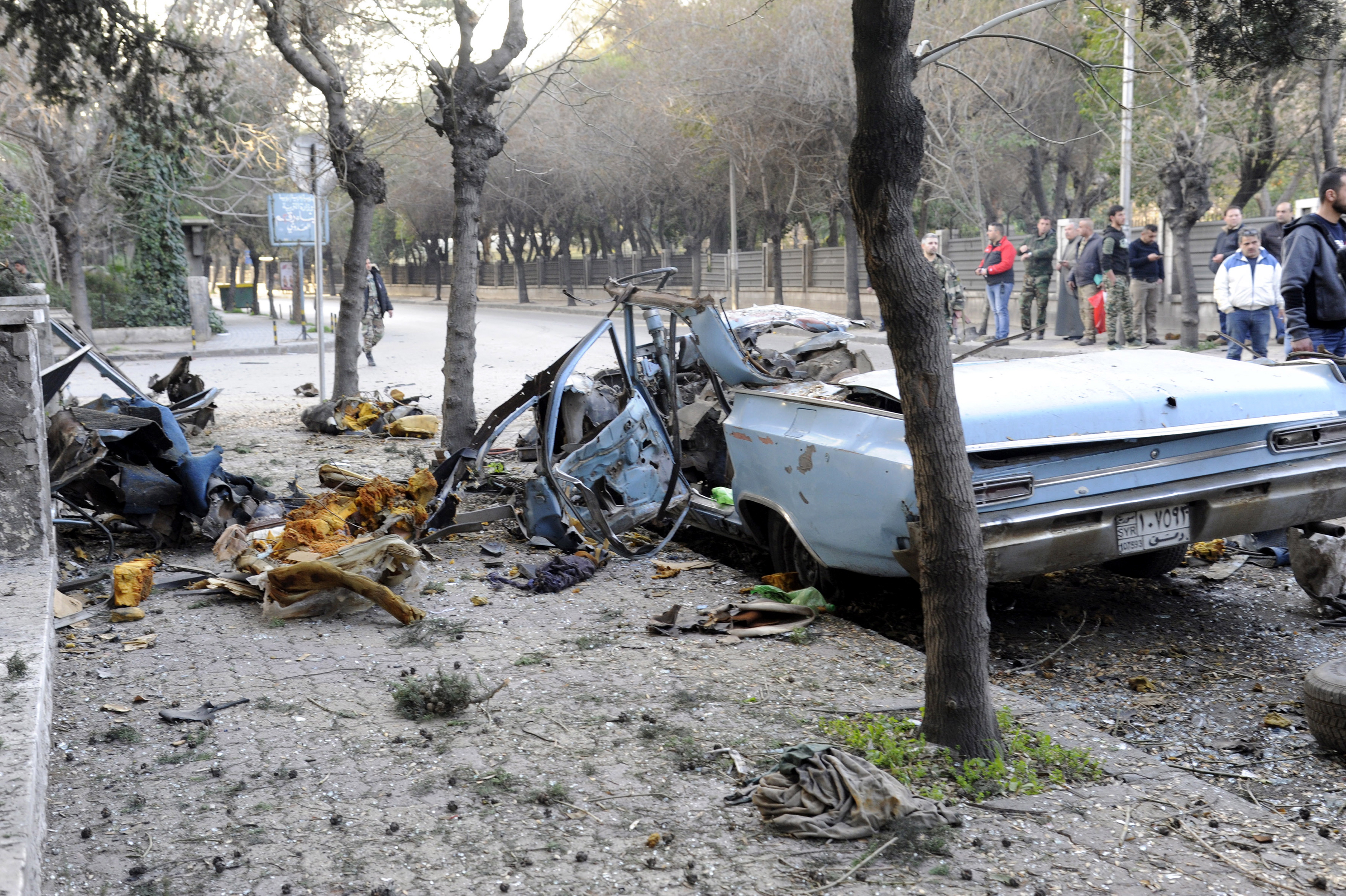 epa07316091 A handout photo made available by the Syrian Arab News Agency (SANA) shows the remains of a car following a blast that took place in al-Adawi area in Damascus, Syria, 24 January 2019. An explosive device planted to a car, causing material damage, and no causalities were reported, according to SANA.  EPA/SANA HANDOUT  HANDOUT EDITORIAL USE ONLY/NO SALES