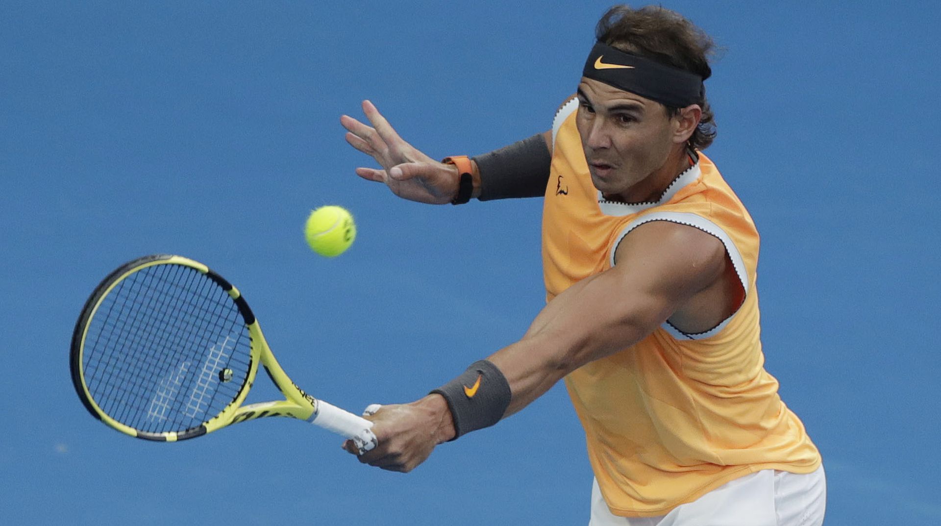 epa07323589 Rafael Nadal of Spain in action during his men's singles final match against Novak Djokovic of Serbia at the Australian Open Grand Slam tennis tournament in Melbourne, Australia, 27 January 2019.  EPA/LYNN BO BO