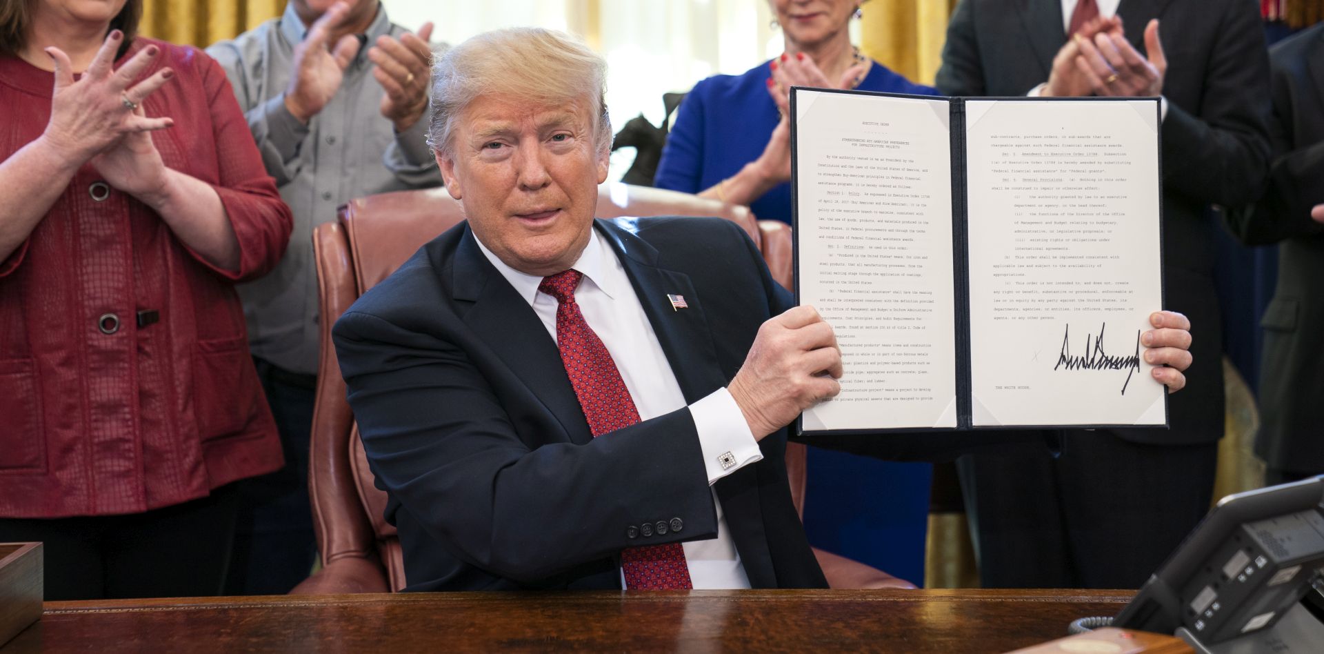 epa07334224 US President Donald J. Trump (C) meets with American manufacturers and signs an Executive Order to 'strengthen the Trump Administration's 'Buy American' policy' in the Oval Office of the White House in Washington, DC, USA, 31 January 2018. The President used the opportunity to speak to the media about his upcoming summit with North Korea, as well as his admonishment of his intelligence chiefs.  EPA/JIM LO SCALZO