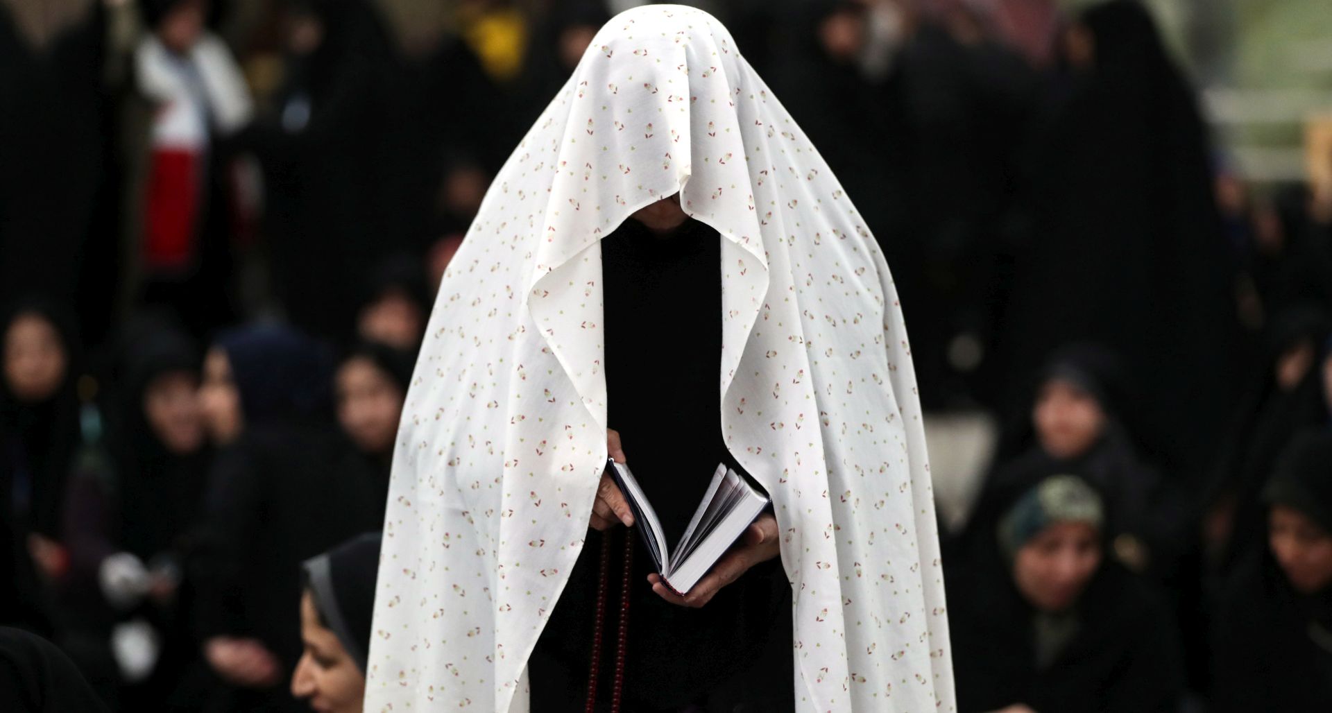 epa07335721 An Iranian woman prays  inside the shrine of Iran's late founder of the Islamic Republic, Ayatollah Ruhollah Khomeini on the occasion of the 40th anniversary of Khomeini's return from exile from Paris, at his mausoleum in southern Tehran, Iran, 01 February 2019. Iran will celebrate its 40th revolution anniversary on 11 February 2019.  EPA/ABEDIN TAHERKENAREH