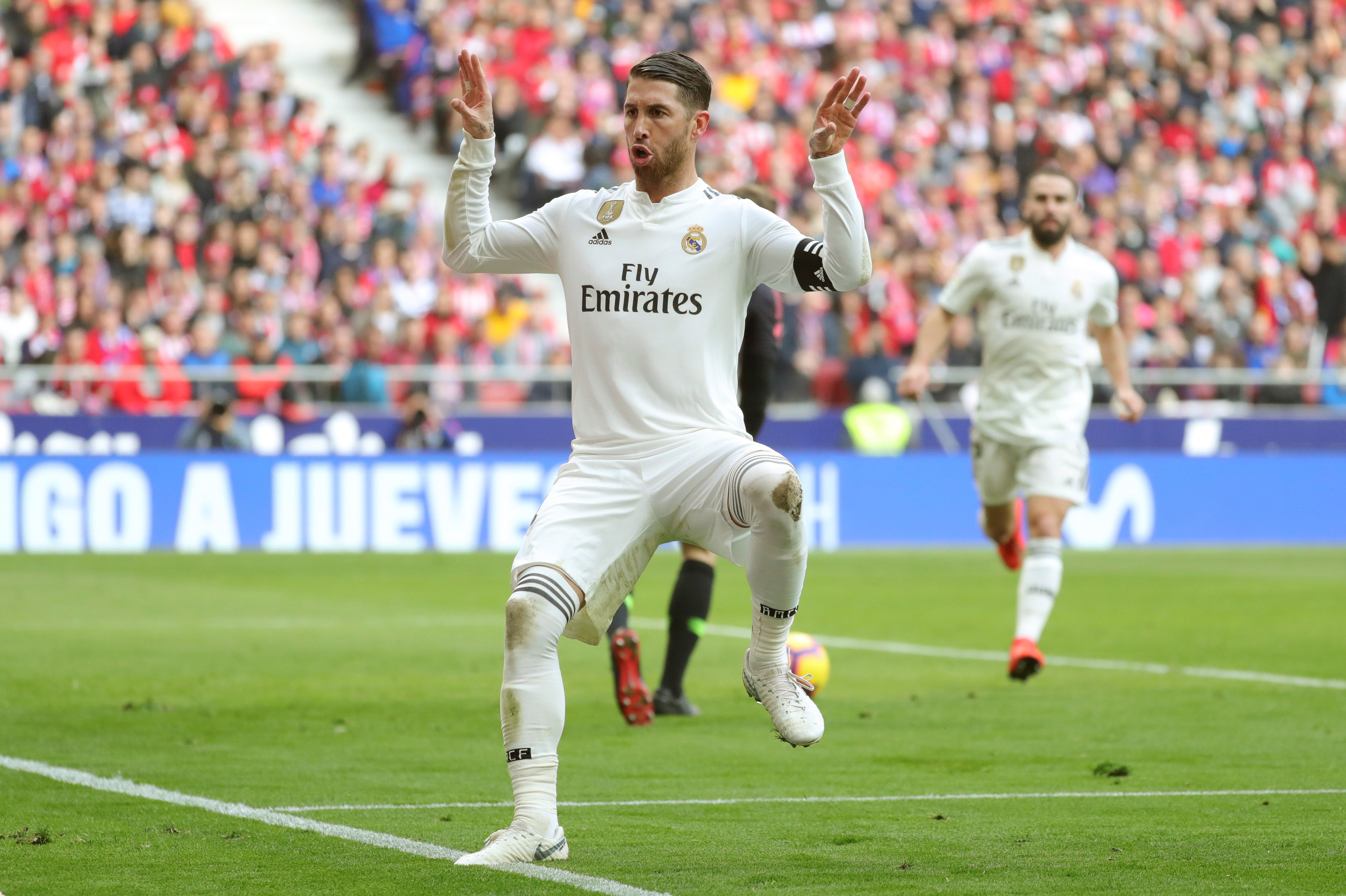 epa07356051 Real Madrid's captain Sergio Ramos celebrates after scoring the 1-2 lead during a Spanish LaLiga soccer match between Atletico Madrid and Real Madrid at the Wanda Metropolitano stadium in Madrid, Spain, 09 February 2019.  EPA/JUANJO MARTIN