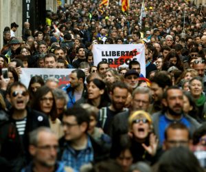 epa07385133 Several thousand demonstrators hold banners reading 'Democracy' during a rally amid the 24-hour Catalan general strike, called by Intersindical-CSIC trade union, in downtown Barcelona, northeastern Spain, 21 February 2019. This protest was called in Catalonia against the case trial of pro-independence defendants at Spain's Supreme Court. This strike is the third one, directly linked to pro-independence process, that was called in the Spanish region. The first Catalan 'national' strike was called on 03 October 2017, two days after October 1st referendum, and the second one was organized on 08 November 2017.  EPA/Toni Albir