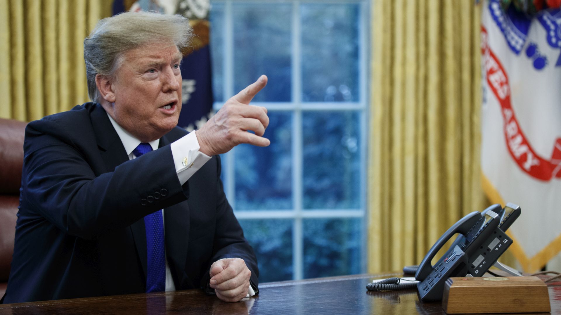 epa07388903 US President Donald J. Trump responds to a question from the news media during a meeting in the Oval Office of the White House in Washington, DC, USA, 22 January 2019. The US and China are aiming to ease the current trade war and the tit for tat tariffs that are unnerving the global economy.  EPA/SHAWN THEW