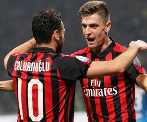 epa07389050 Milan's Krzysztof Piatek (R) celebrates with his teammate Hakan Calhanoglu (L) after scoring the 1-0 lead during the Italian Serie A soccer match between AC Milan and Empoli FC at the Giuseppe Meazza stadium in Milan, Italy, 22 Februray 2019.  EPA/DANIEL DAL ZENNARO