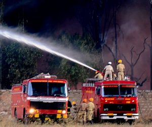epa07366721 Indian firefighters try to extinguish flames after a fire broke out at the United Paint factory stockyard in madanayakanahalli, on the outskirts of Bangalore, India, 13 February 2019. According to police and media reports, about 15 fire engines fought for close to four hours to extinguish the blaze. No casualties have been reported in the incident so far.  EPA/JAGADEESH NV