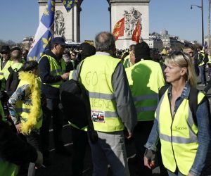 epa07389890 Protesters from the 'Gilets Jaunes' (Yellow Vests) movement gather at the Champs Elysees as they take part in the 'Act XV' demonstration (the 15th consecutive national protest on a Saturday) in Paris, France, 23 February 2019. The so-called 'gilets jaunes' (yellow vests) is a grassroots protest movement with supporters from a wide span of the political spectrum, that originally started with protest across the nation in late 2018 against high fuel prices. The movement in the meantime also protests the French government's tax reforms, the increasing costs of living and some even call for the resignation of French President Emmanuel Macron.  EPA/YOAN VALAT