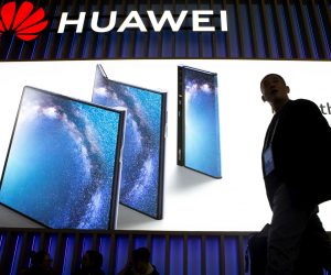 epa07396786 A visitor walks past the stand of Huawei on the opening day of the Mobile World Congress 2019 (MWC19), in Barcelona, Spain, 25 February 2019. The MWC19 will present the latest advances in mobile technologies from 25 to 28 February at the Fira Barcelona Montjuic.  EPA/Enric Fontcuberta