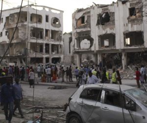 epa07406959 People gather at the scene of a siege that killed some 20 people in Mogadishu, Somalia, 01 March 2019. Somali officials say the security forces ened a day-long siege that began previous night by killing the last one of three al-Shabab gunmen holed up in a building. Ambulance service official told EPA-EFE that some 25 people were killed in the attack started with a car bomb explosion on late 28 February.  EPA/SAID YUSUF WARSAME