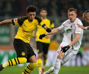 epa07407403 Jadon Sancho of Dortmund (L) in action with Georg Teigl of Augsburg during the German Bundesliga soccer match between FC Augsburg and Borussia Dortmund in Augsburg, Germany, 01 March 2019.  EPA/DANIEL KOPATSCH CONDITIONS - ATTENTION: The DFL regulations prohibit any use of photographs as image sequences and/or quasi-video.