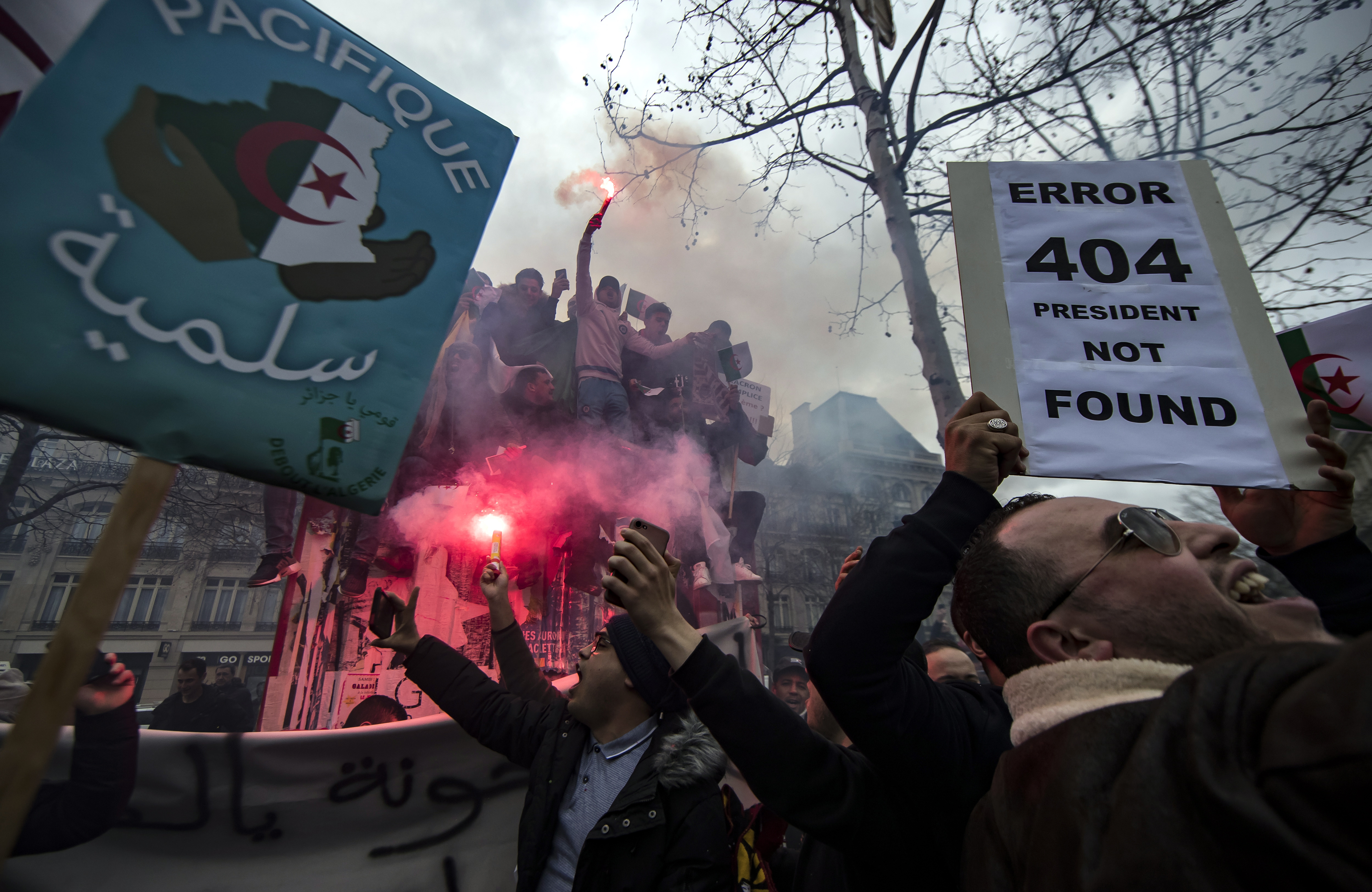 epa07411052 Members of the Algerian community in Paris protest against the fifth term of Algerian President Abdelaziz Bouteflika on Place de la Republique in Paris, France, 03 March 2019. The registration process for the upcoming presidential elections in Algeria closed on 03 March, while there was still no official confirmation as to whether the country's ailing president, whose bid for re-election sparked widespread protests, had submitted his candidacy papers. Abdelaziz Bouteflika, serving as the president since 1999, has announced on 19 February he will be running for a fifth term in presidential elections scheduled for 18 April 2019.  EPA/IAN LANGSDON