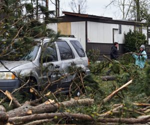 epa07413524 Volunteers from the community help clear debris from an area which the previsou day was hit by a tornado, in Beauregard, Alabama, USA, 04 March 2019. So far 23 in the state are confirmed dead.  EPA/John Amis