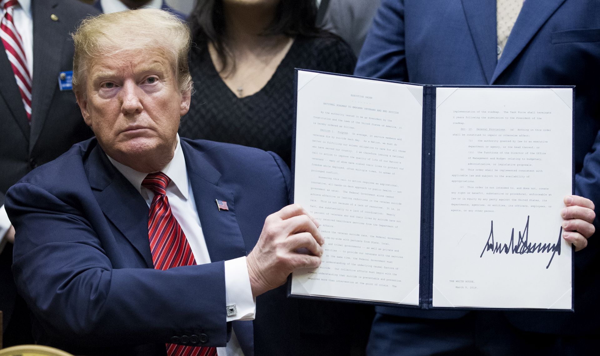 epa07415936 US President Donald J. Trump holds up an executive order he just signed - a 'President's Roadmap to Empower Veterans and End a National Tragedy of Suicide', also known as 'the PREVENTS initiative'; in the Roosevelt Room of the White House in Washington, DC, USA, 05 March 2019. A task force newly-created by the White House aims to coordinate research and veteran suicide prevention efforts across numerous government agencies. An estimated twenty US service members and veterans die by suicide each day.  EPA/MICHAEL REYNOLDS